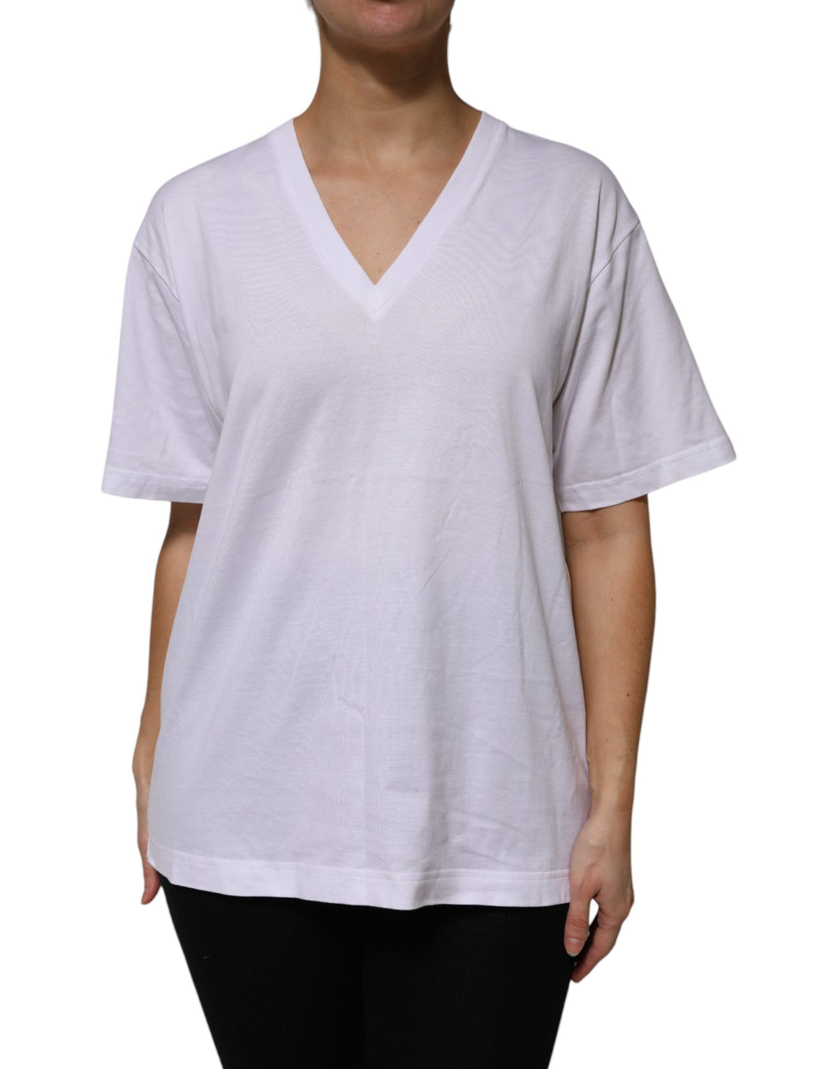 Elevate your wardrobe with the Dolce & Gabbana White Cotton Short Sleeves V-neck T-shirt, a luxurious piece embodying Italian craftsmanship and timeless elegance.