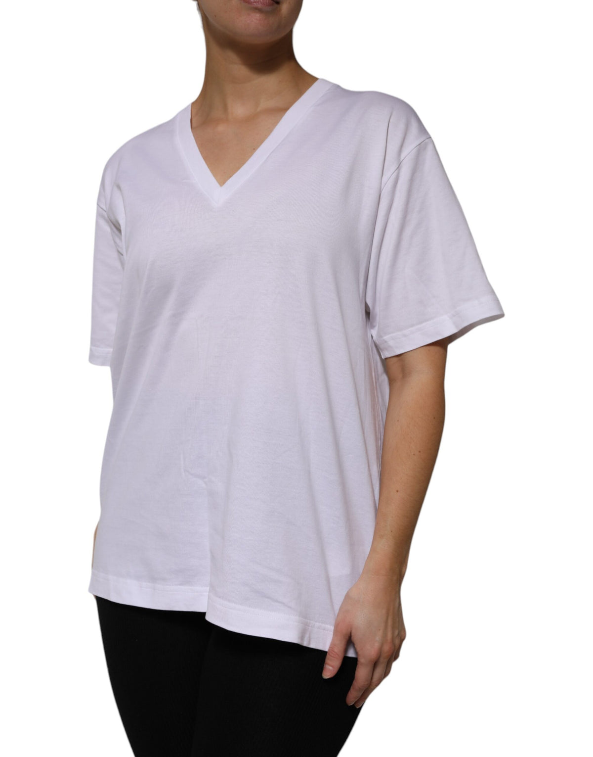 Elevate your wardrobe with the Dolce & Gabbana White Cotton Short Sleeves V-neck T-shirt, a luxurious blend of exquisite craftsmanship and timeless elegance, perfect for any occasion.
