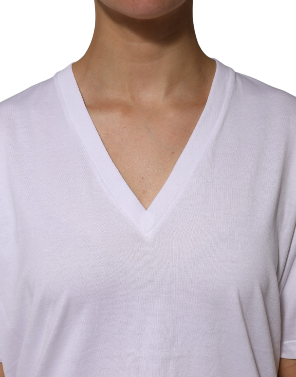 Elevate your wardrobe with the Dolce & Gabbana White Cotton Short Sleeves V-neck T-shirt, a luxurious blend of exquisite craftsmanship and timeless elegance, perfect for every occasion.