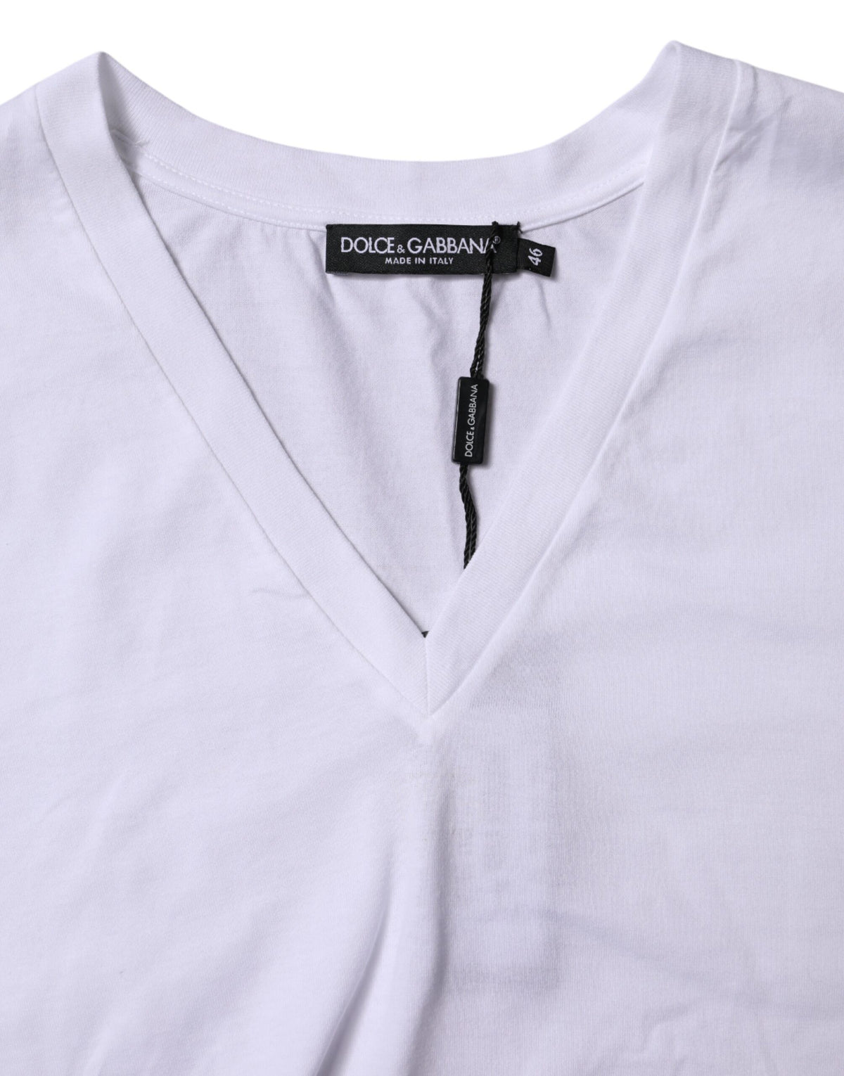 Elevate your wardrobe with the Dolce & Gabbana White Cotton Short Sleeves V-neck T-shirt, a luxurious blend of Italian craftsmanship and timeless elegance, perfect for any sophisticated occasion.