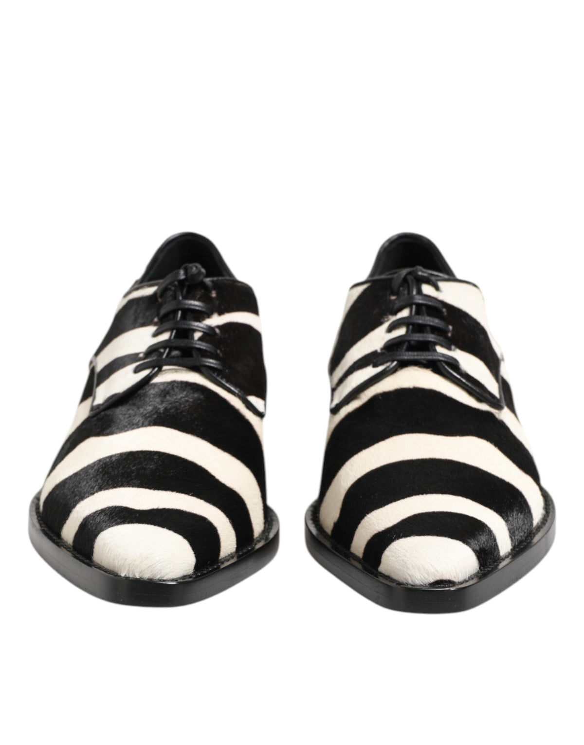 Experience the exquisite allure of Dolce & Gabbana's Black White Zebra Pony Fur Dress Shoes, where opulent calf fur meets refined craftsmanship for a statement of sophistication.