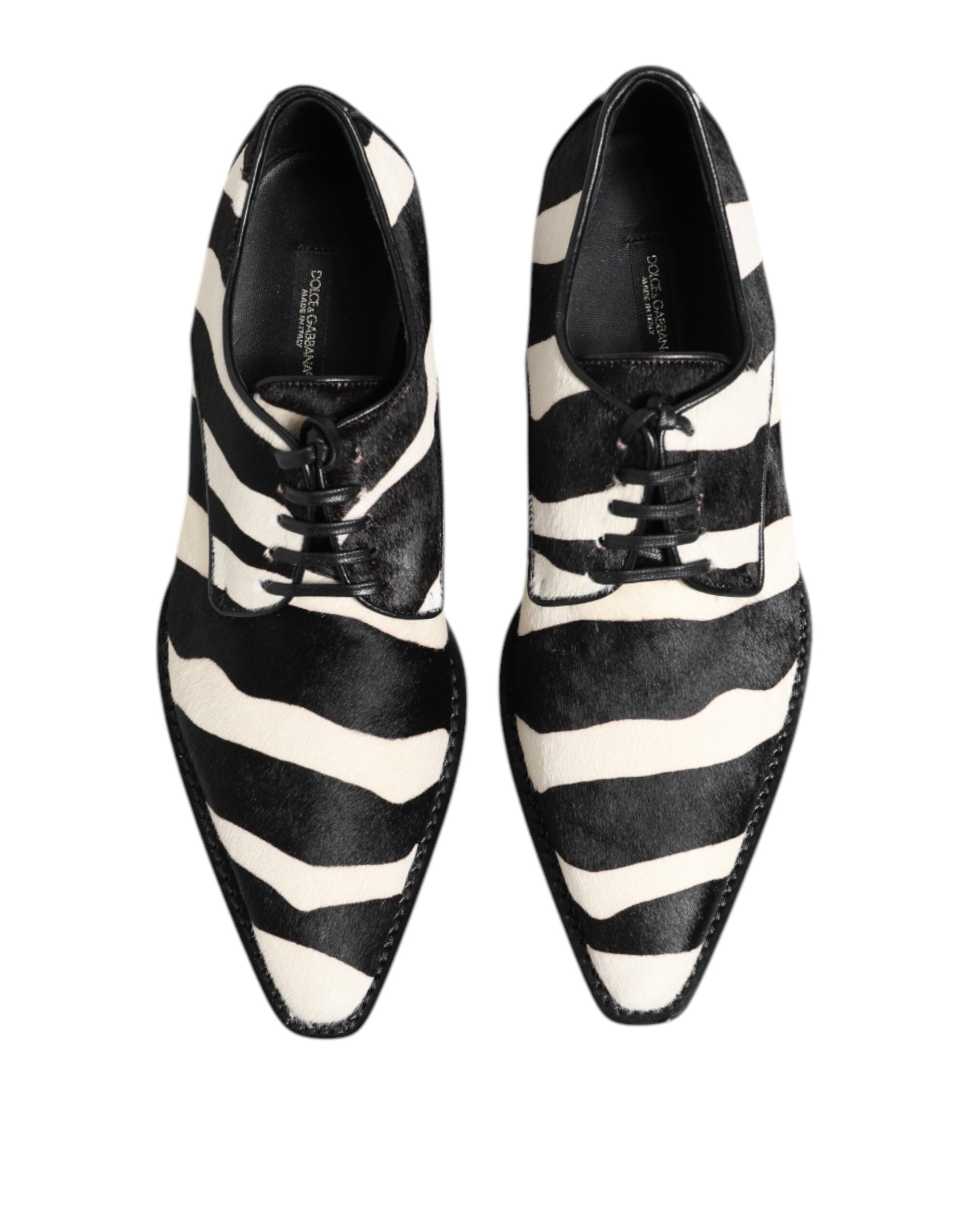 Experience the allure of Dolce & Gabbana's Black White Zebra Pony Fur Dress Shoes, where opulent calf fur meets refined craftsmanship for a statement of sophistication.