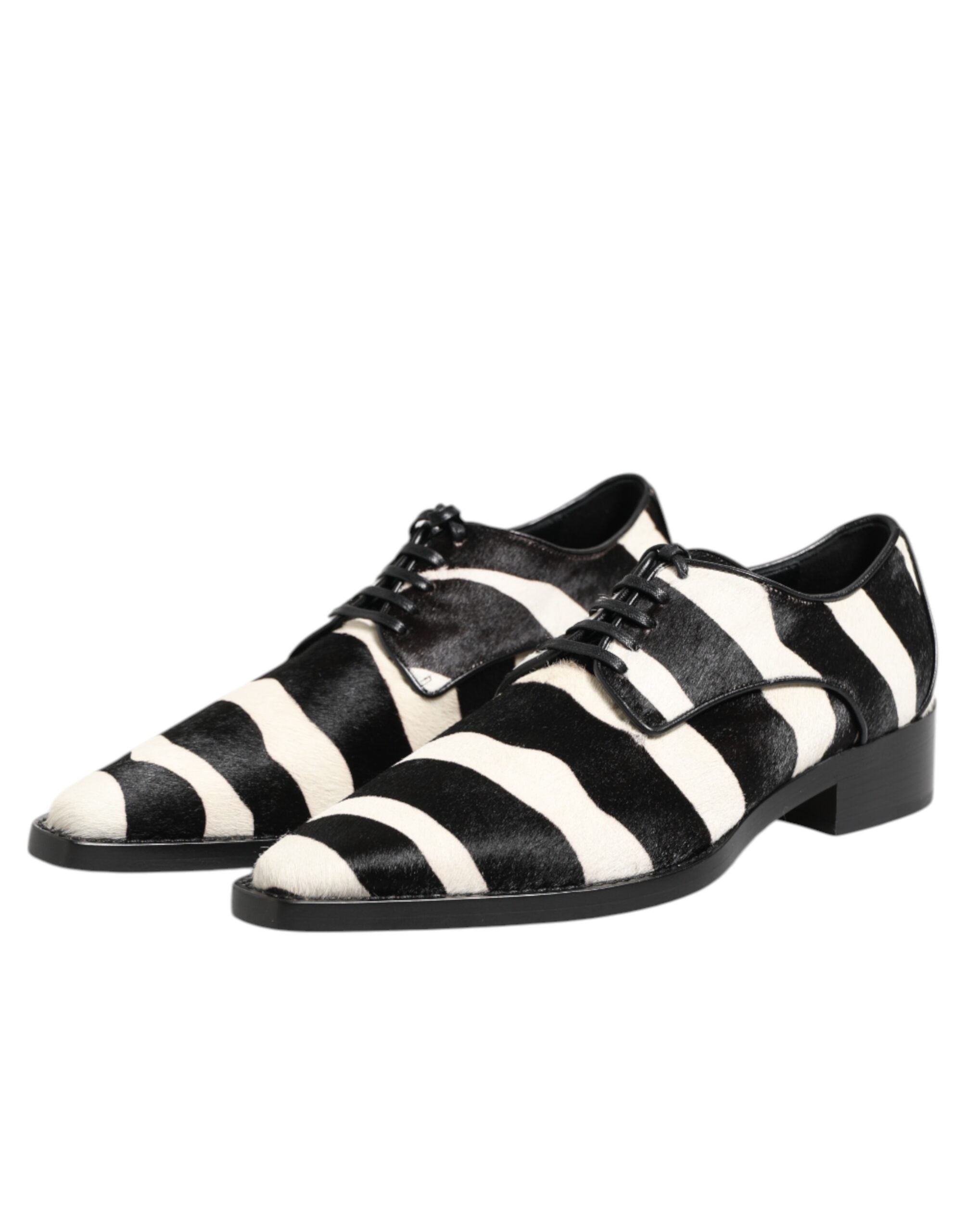 Step into unparalleled elegance with Dolce & Gabbana's Black White Zebra Pony Fur Dress Shoes, where luxurious calf fur meets exquisite craftsmanship for a statement of sophistication.