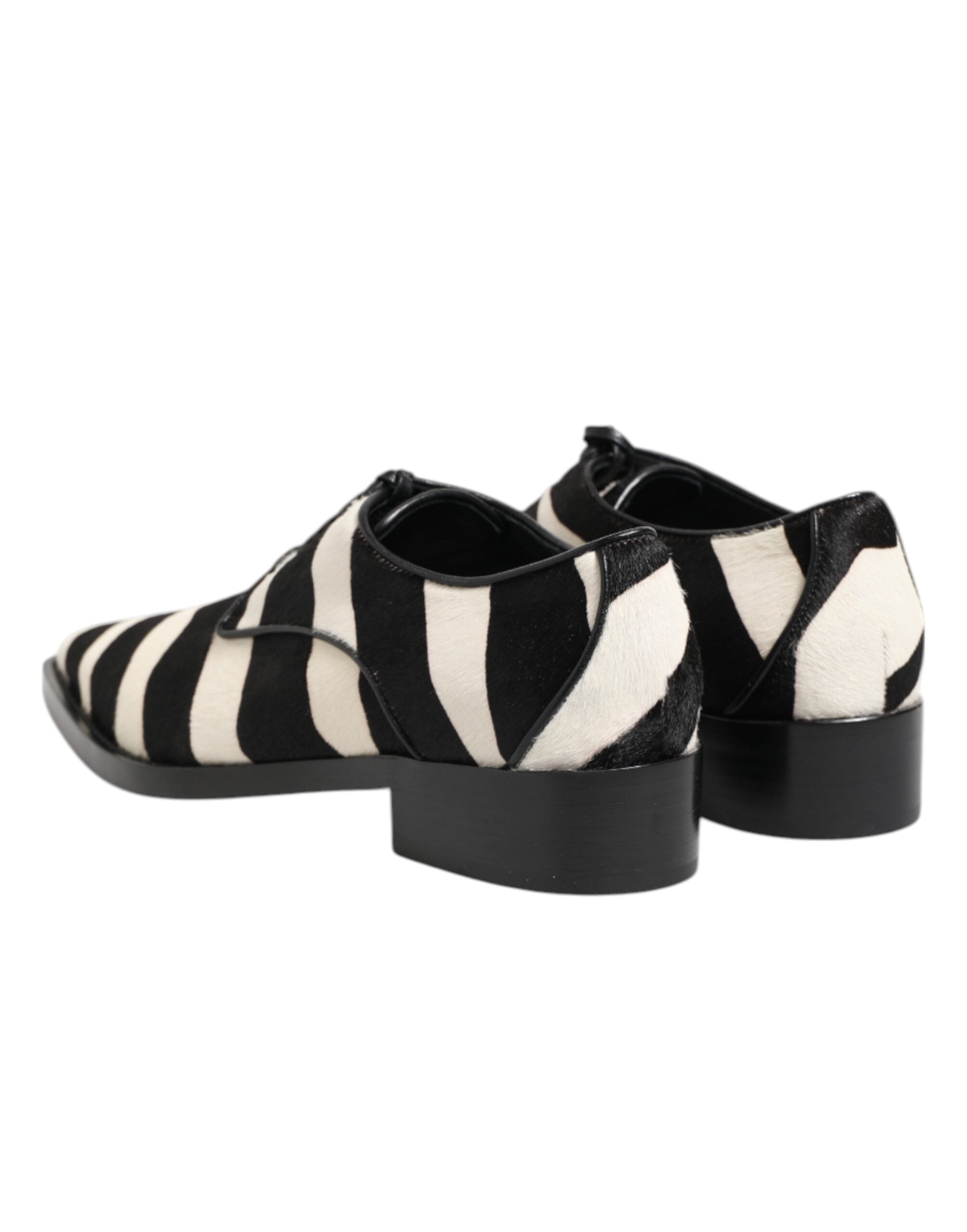 Step into elegance with Dolce & Gabbana's Black White Zebra Pony Fur Dress Shoes, where sumptuous materials and exquisite craftsmanship redefine luxury footwear.