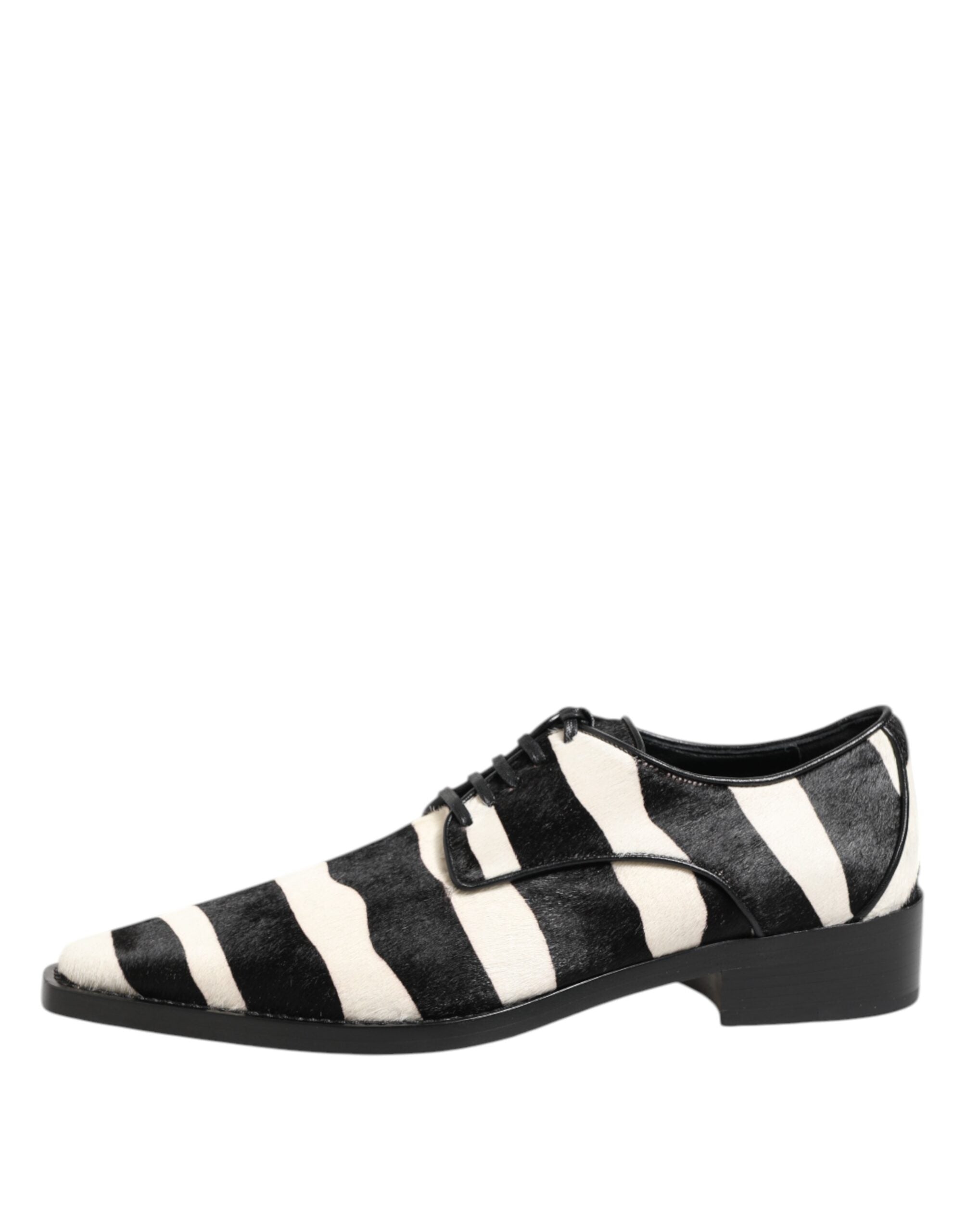 Elevate your style with Dolce & Gabbana's Black White Zebra Pony Fur Dress Shoes, where exquisite calf fur meets refined craftsmanship for a statement of unparalleled luxury.