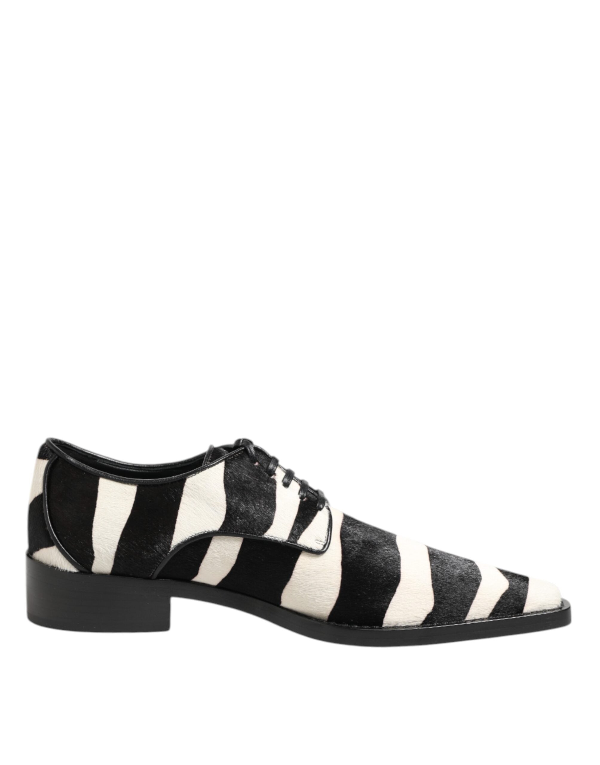Step into a world of sophistication with Dolce & Gabbana's Black White Zebra Pony Fur Dress Shoes, where opulent calf fur and exquisite craftsmanship redefine luxury.