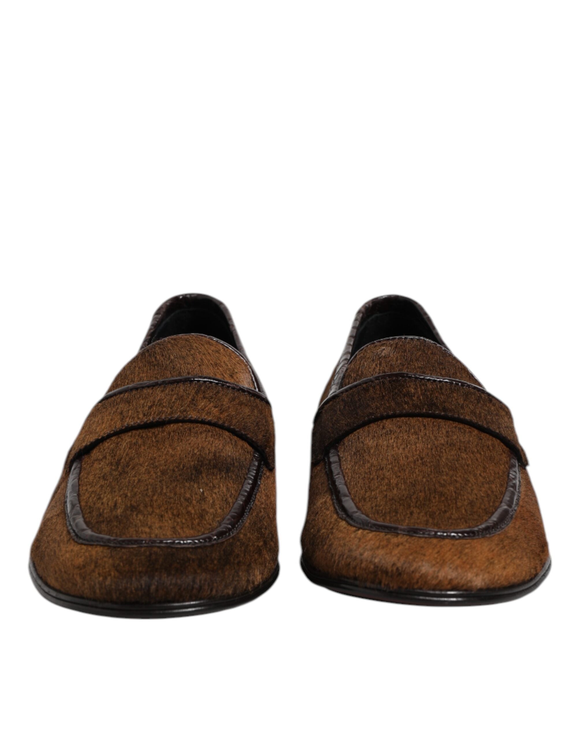 Experience the allure of Dolce & Gabbana Brown Loafers, where caiman and calf fur leather unite in exquisite craftsmanship, embodying timeless luxury for the discerning individual.