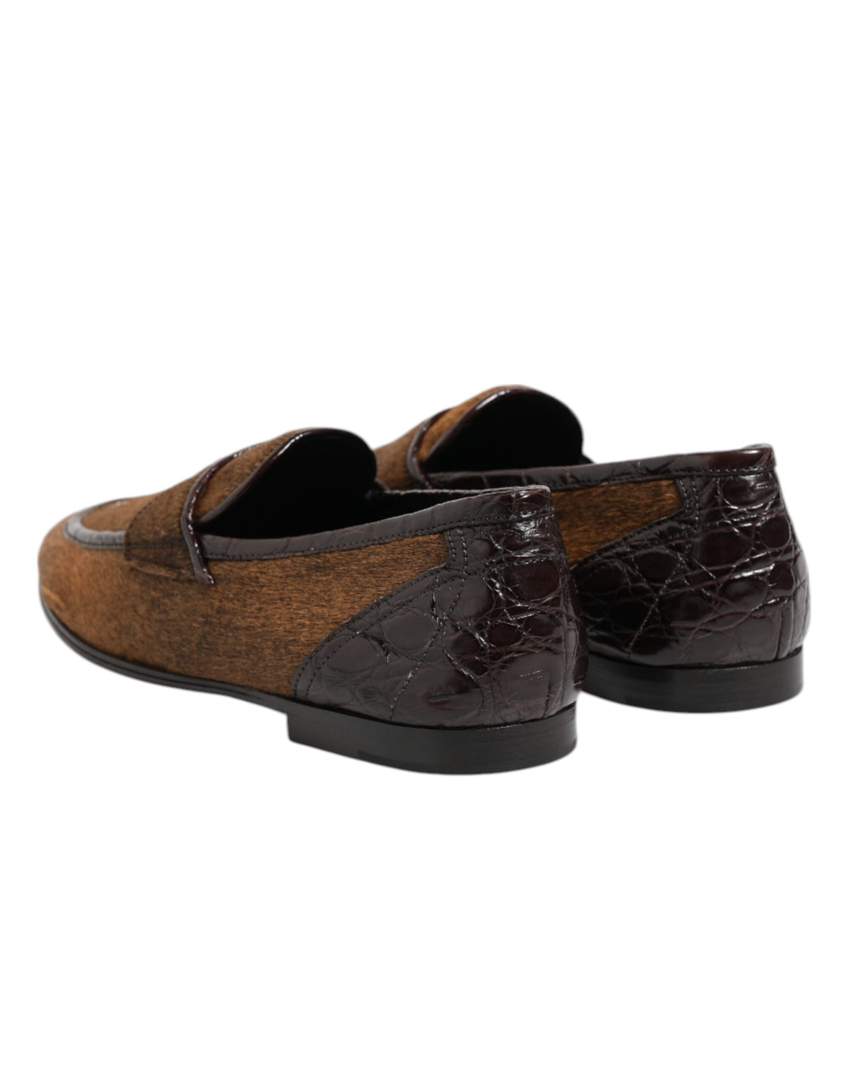 Indulge in the exquisite Dolce & Gabbana Brown Loafers, crafted from caiman and calf fur leather, embodying timeless elegance and unparalleled Italian craftsmanship for the discerning individual.