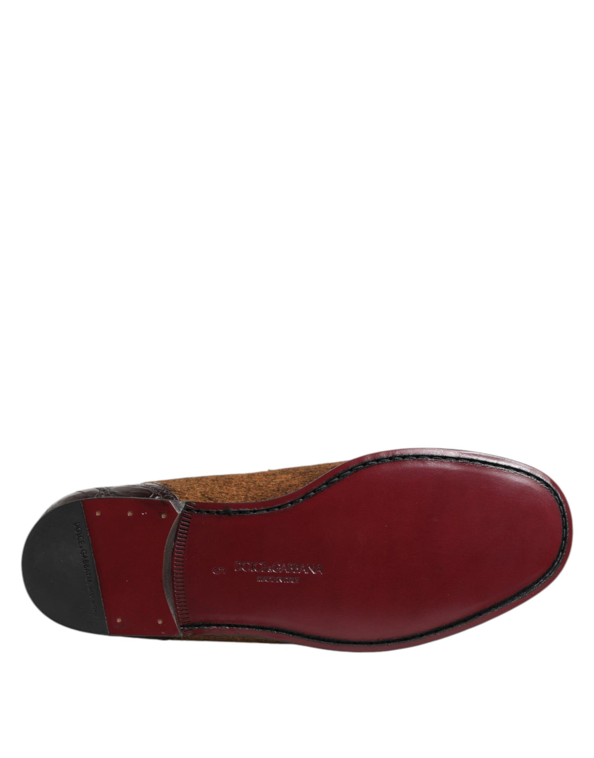 Experience the allure of Dolce & Gabbana Brown Loafers, where exquisite caiman and calf fur leather craftsmanship meets timeless elegance, perfect for the discerning individual.
