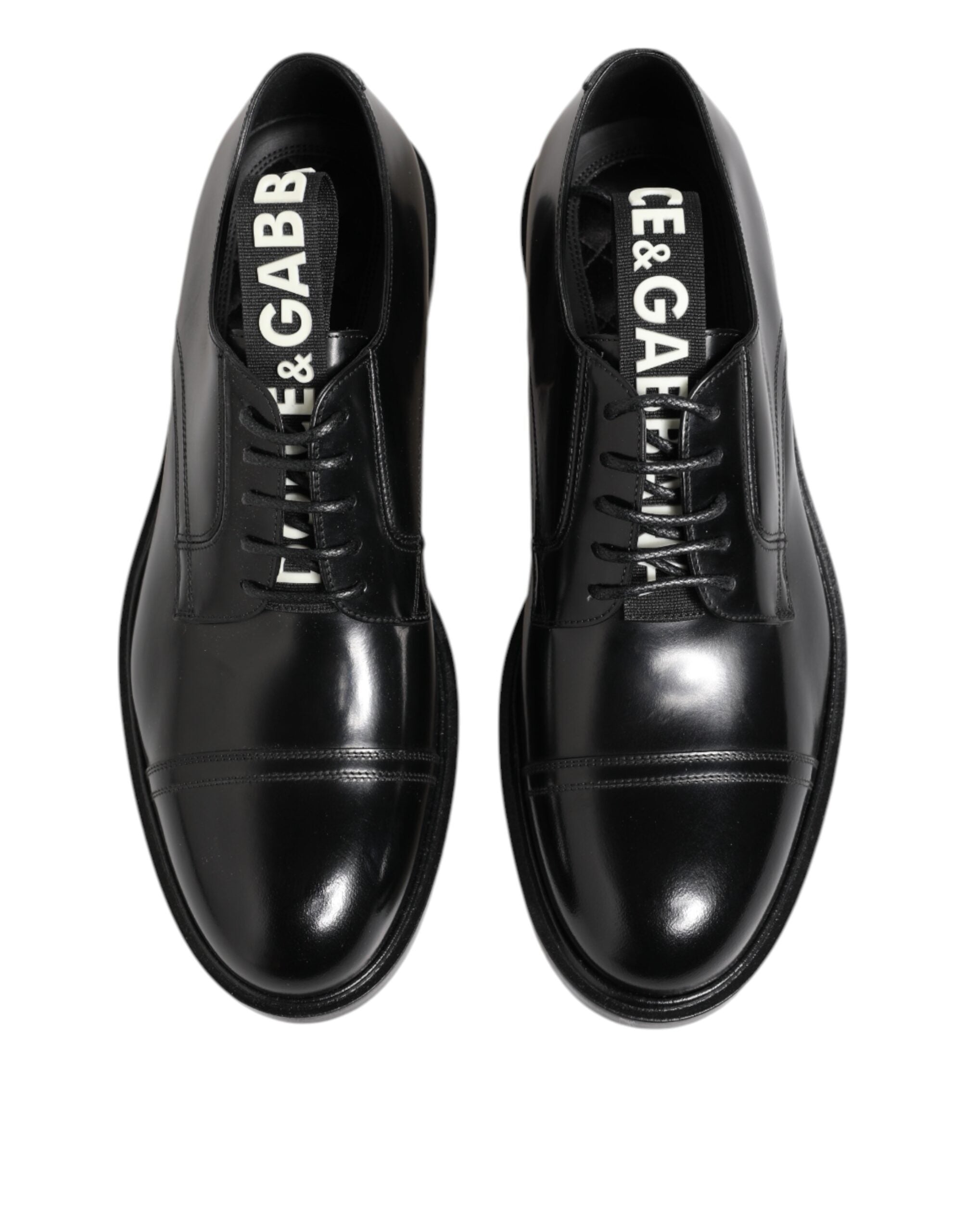 Experience the exquisite craftsmanship of Dolce & Gabbana's Black Leather Dress Lace Up Shoes, a timeless symbol of sophistication that elevates your presence.