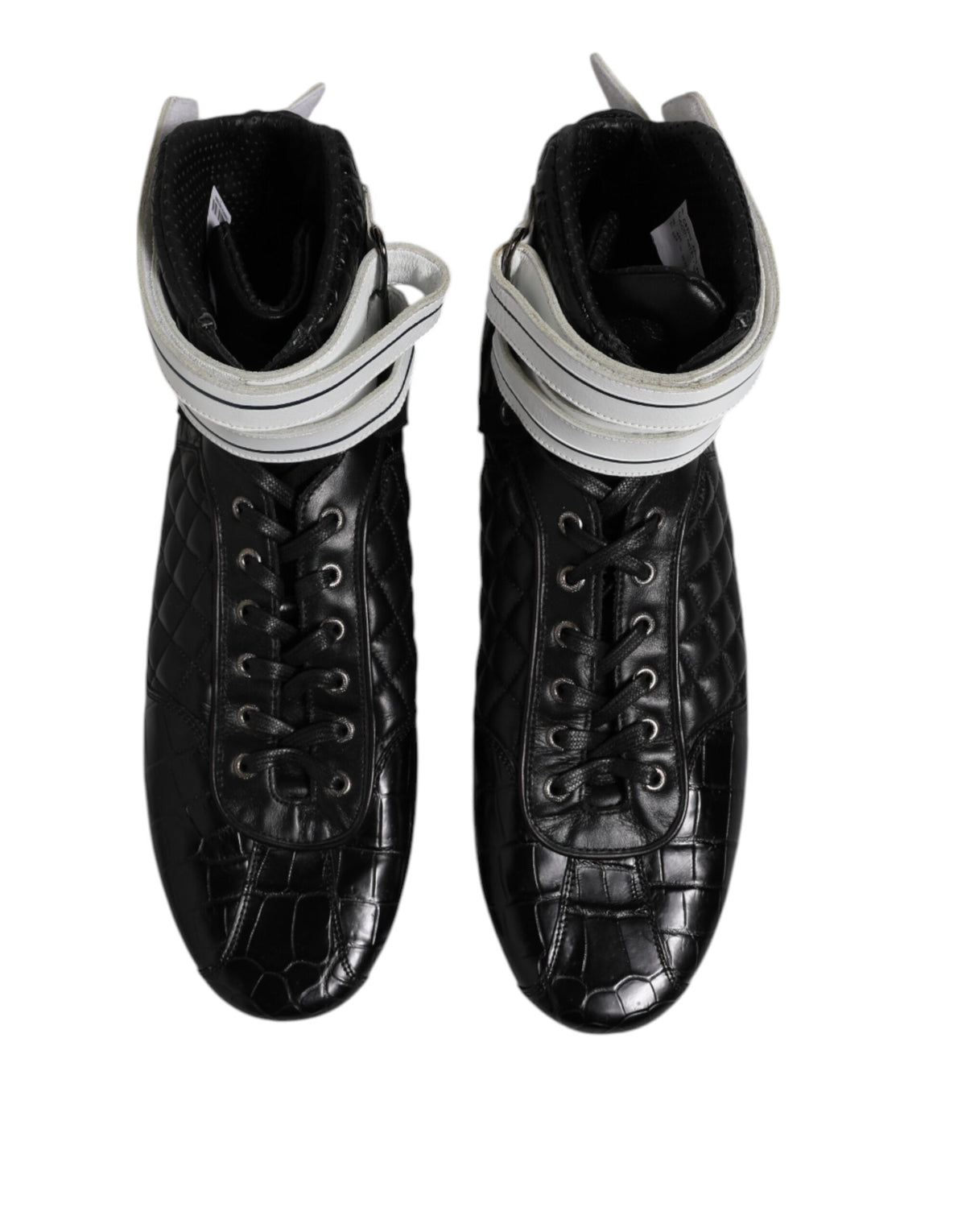Experience the exquisite craftsmanship of Dolce & Gabbana's Black Quilted Leather Lace Up Sneakers, where luxurious materials meet timeless elegance for the discerning individual.