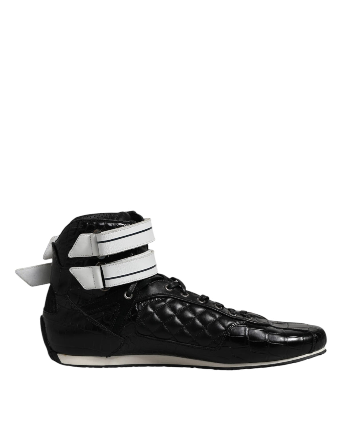 Experience the epitome of luxury with Dolce & Gabbana's Black Quilted Leather Lace Up Sneakers, where exquisite craftsmanship meets timeless elegance for the discerning individual.