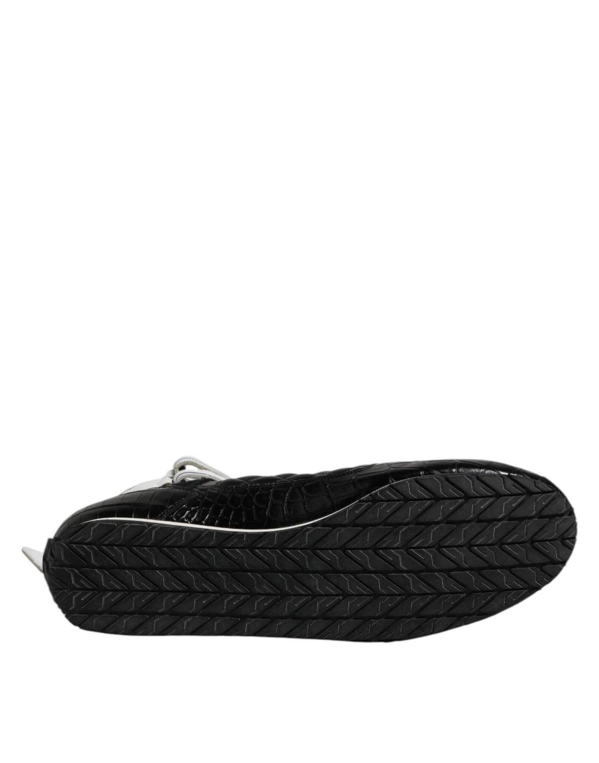 Experience the exquisite craftsmanship of Dolce & Gabbana's Black Quilted Leather Lace Up Sneakers, where luxurious materials meet timeless elegance for the discerning individual.