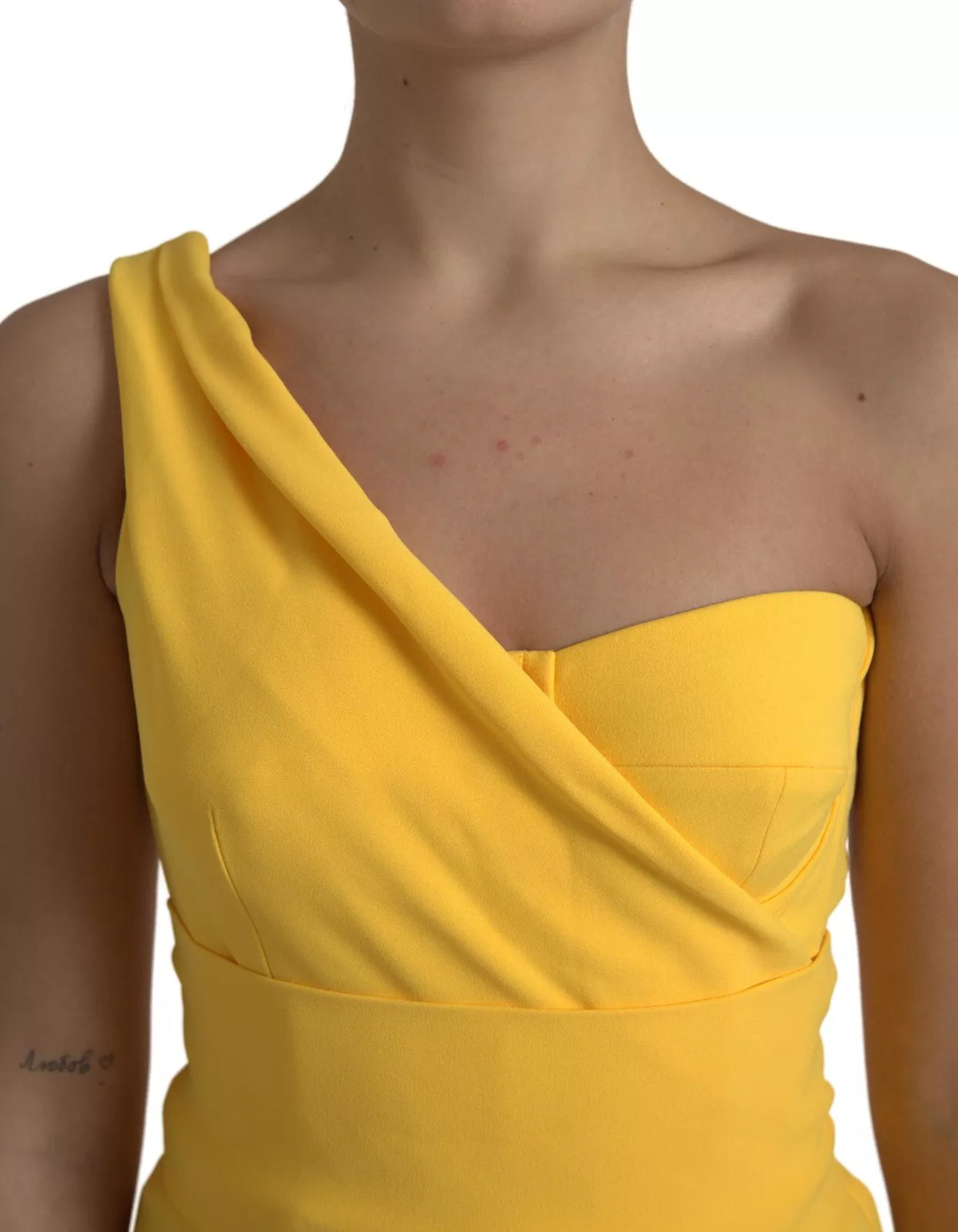 Indulge in the opulence of the Dolce & Gabbana Yellow One Shoulder Side Slit Sheath Dress, where exquisite Italian craftsmanship meets timeless elegance for unforgettable moments.