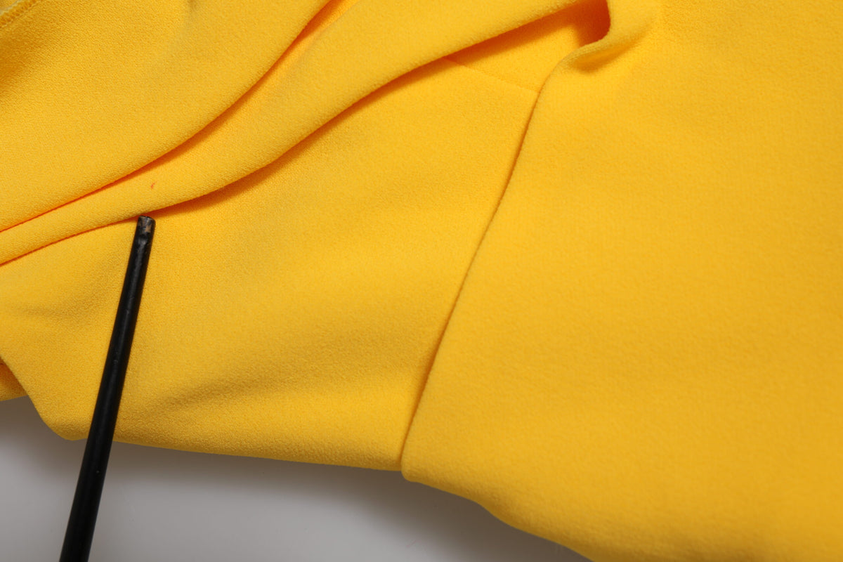 Elevate your wardrobe with the Dolce & Gabbana Yellow One Shoulder Side Slit Sheath Dress, a masterpiece of Italian craftsmanship, perfect for unforgettable moments.