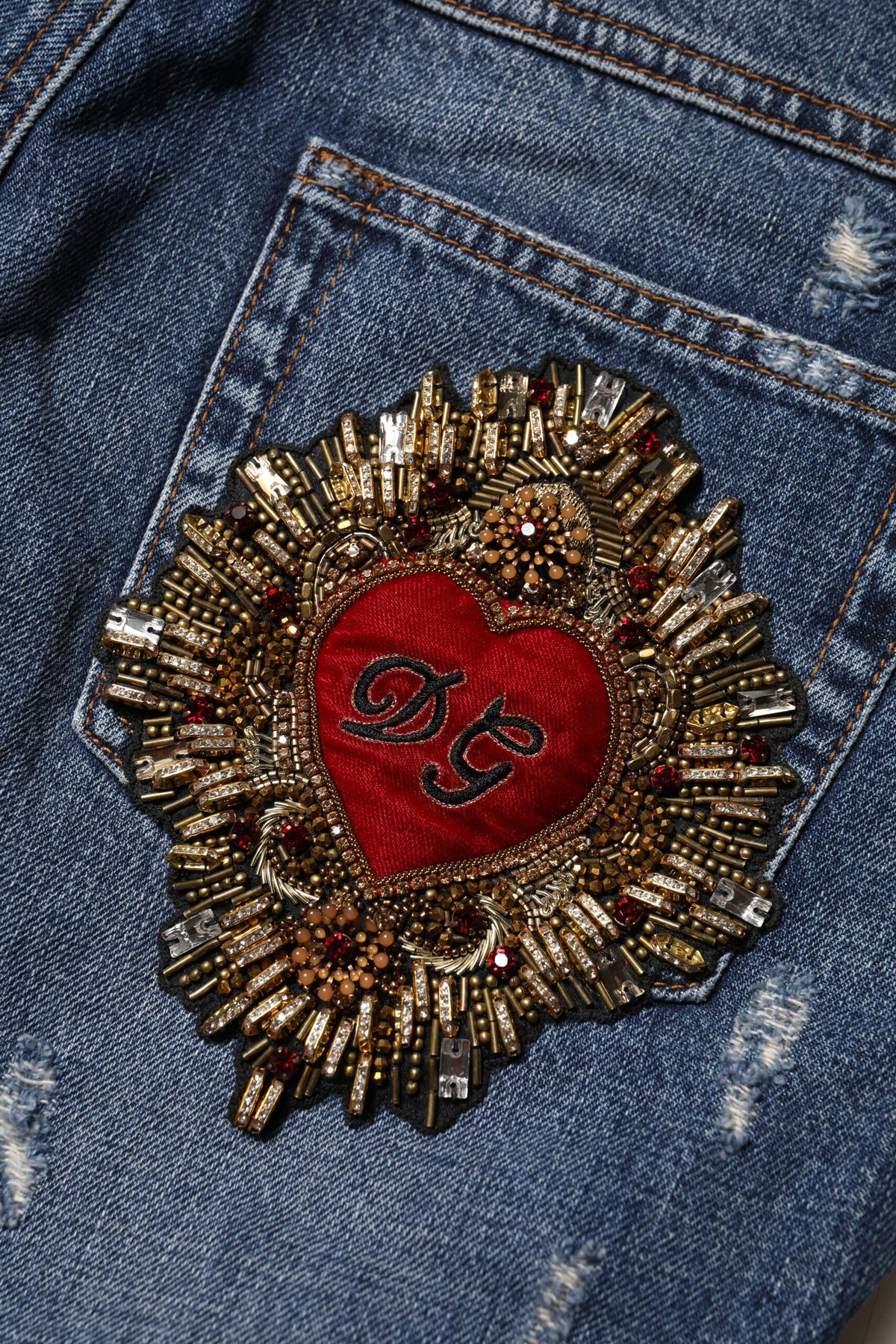 Indulge in the Dolce & Gabbana Blue Cotton Tattered Boyfriend Denim Jeans, where exquisite craftsmanship meets bold elegance, perfect for the discerning individual.