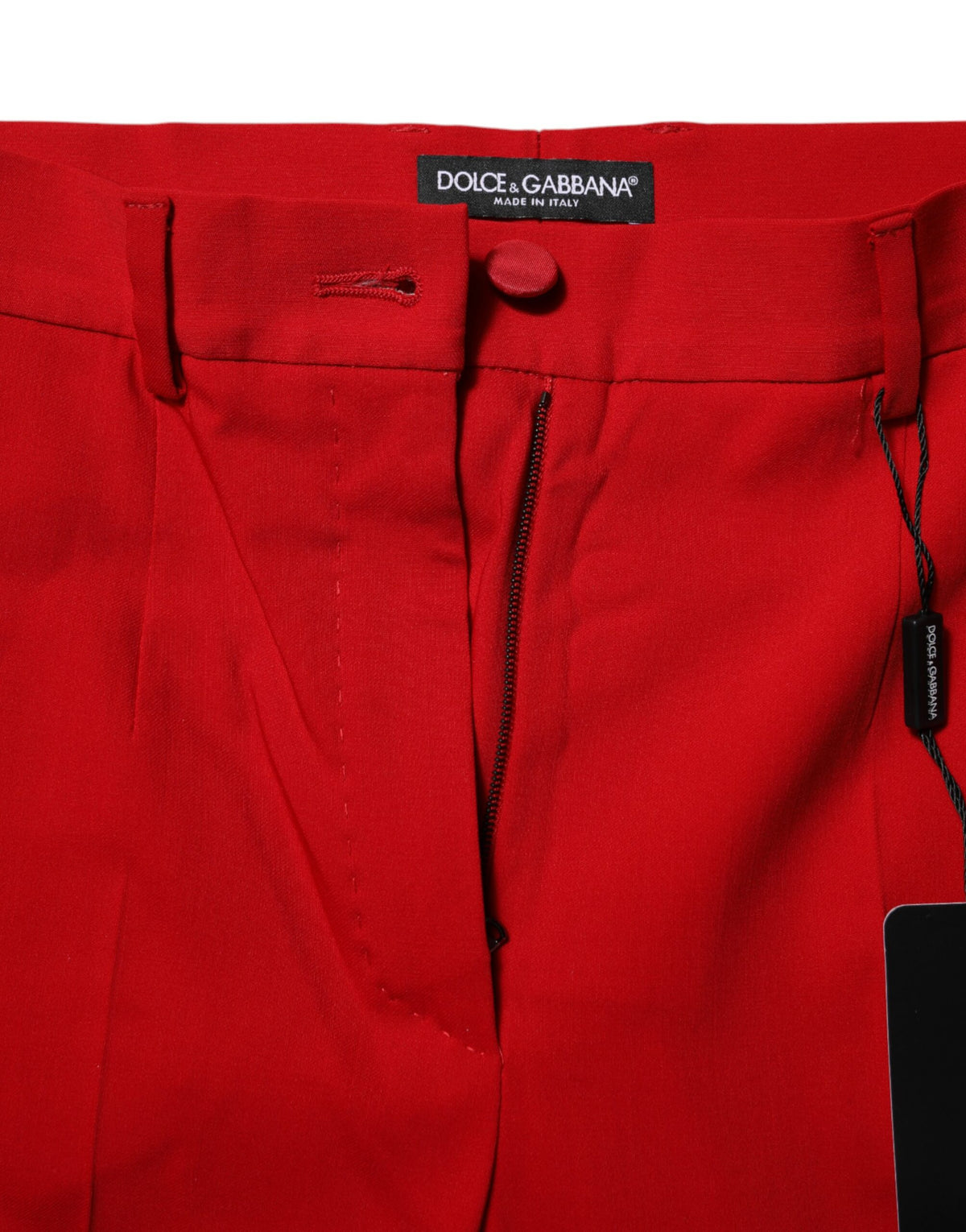 Indulge in the exquisite craftsmanship of Dolce & Gabbana's Red Wool Mid Waisted Tapered Pants, a luxurious blend of wool, silk, and elastane for timeless elegance.