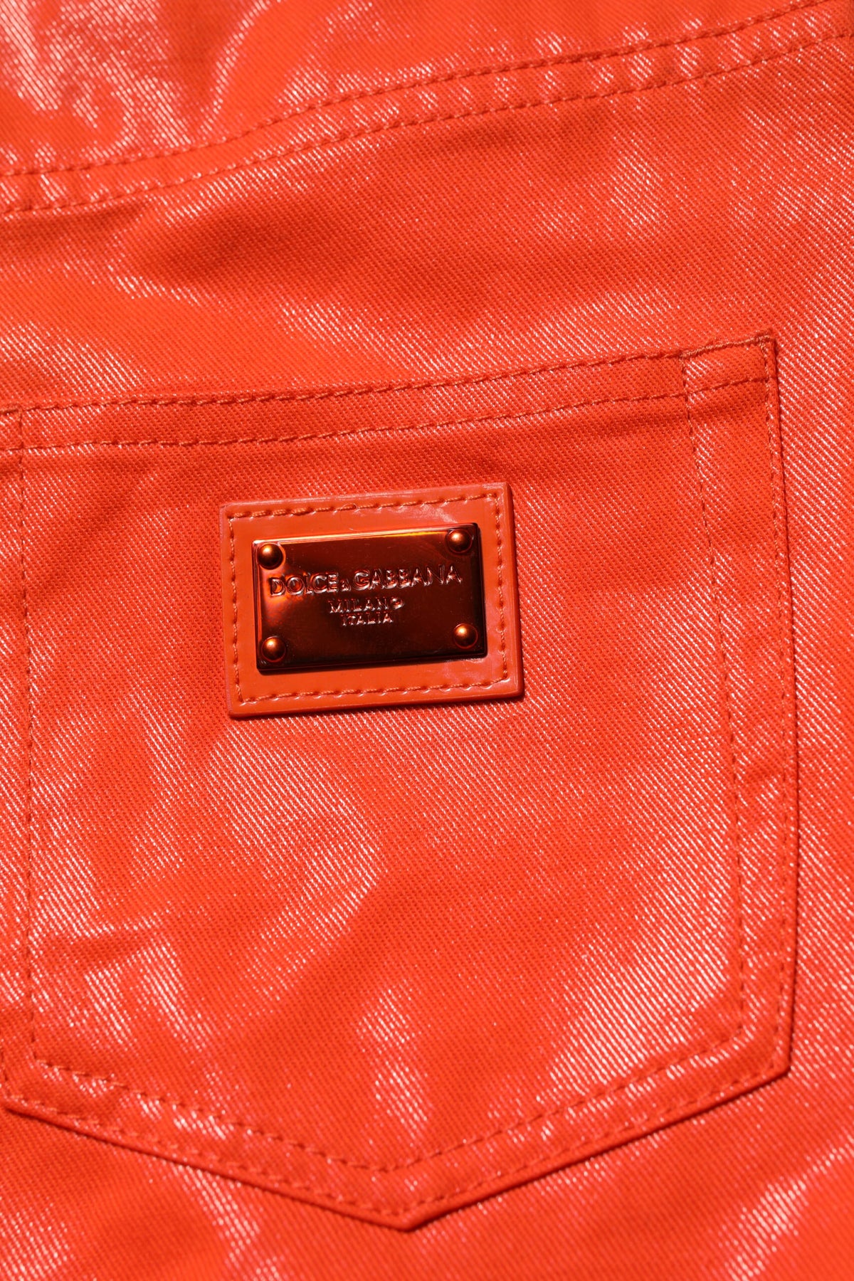 Elevate your wardrobe with Dolce & Gabbana's Orange Cotton High Waisted Denim Jeans, where exquisite craftsmanship meets vibrant luxury, embodying sophistication and allure.