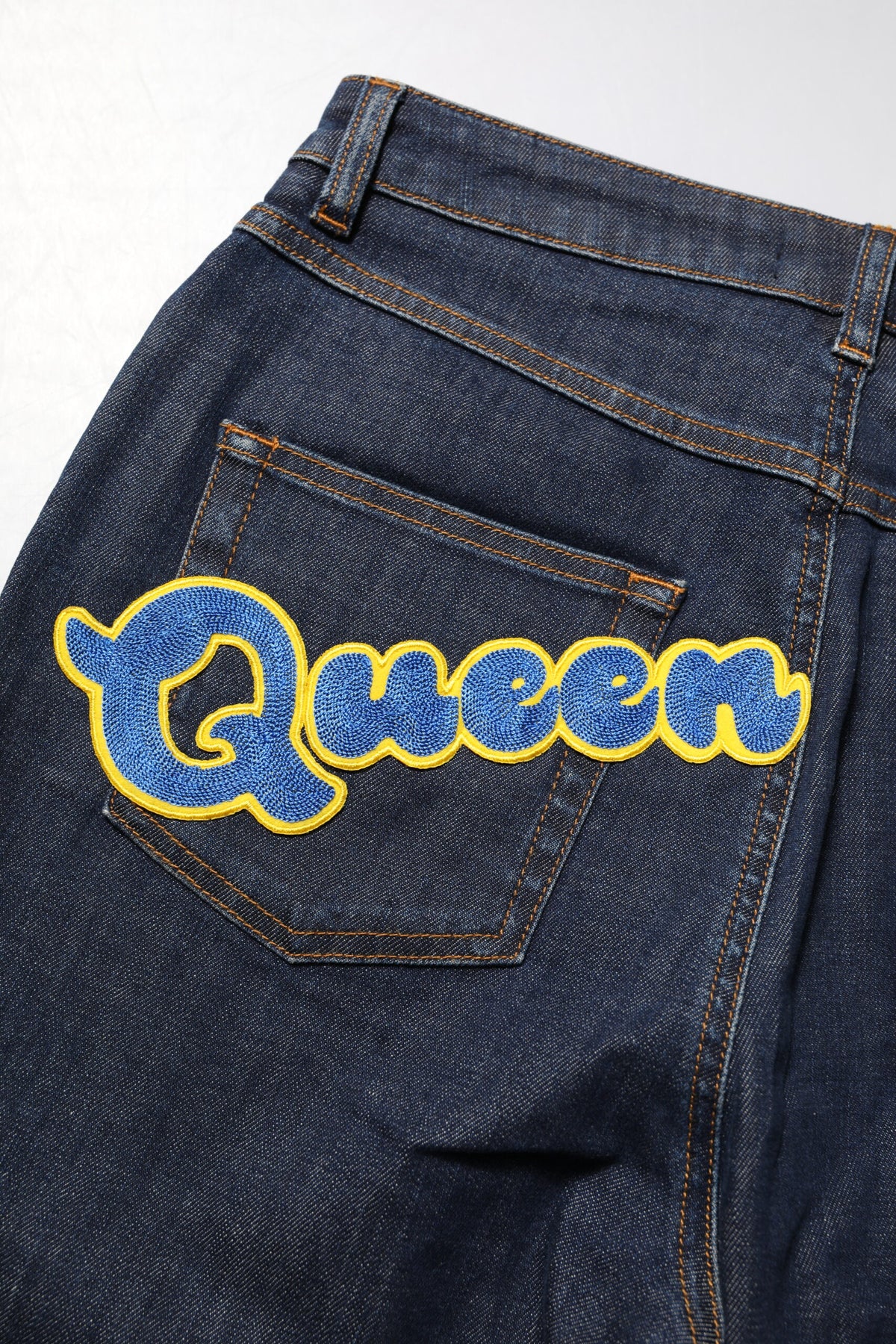 Experience the allure of Dolce & Gabbana's Blue Queen Patch AUDREY Mid Waist Denim Jeans, crafted in Italy from a luxurious cotton blend, embodying elegance and sophistication.