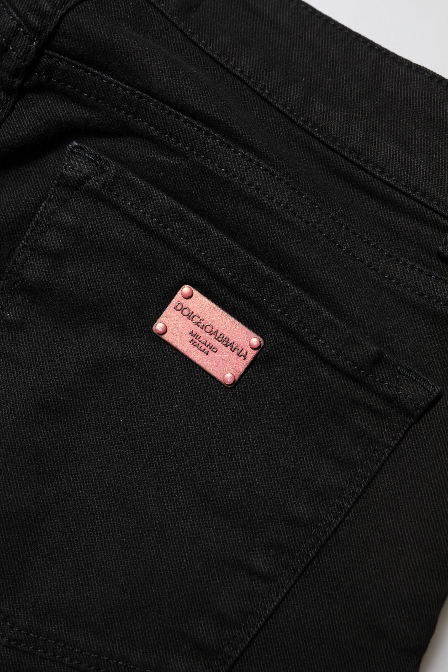 Indulge in the exquisite allure of Dolce & Gabbana's Black Skinny Cotton Mid Waisted Denim Jeans, crafted in Italy for a flawless fit that embodies timeless sophistication and luxury.