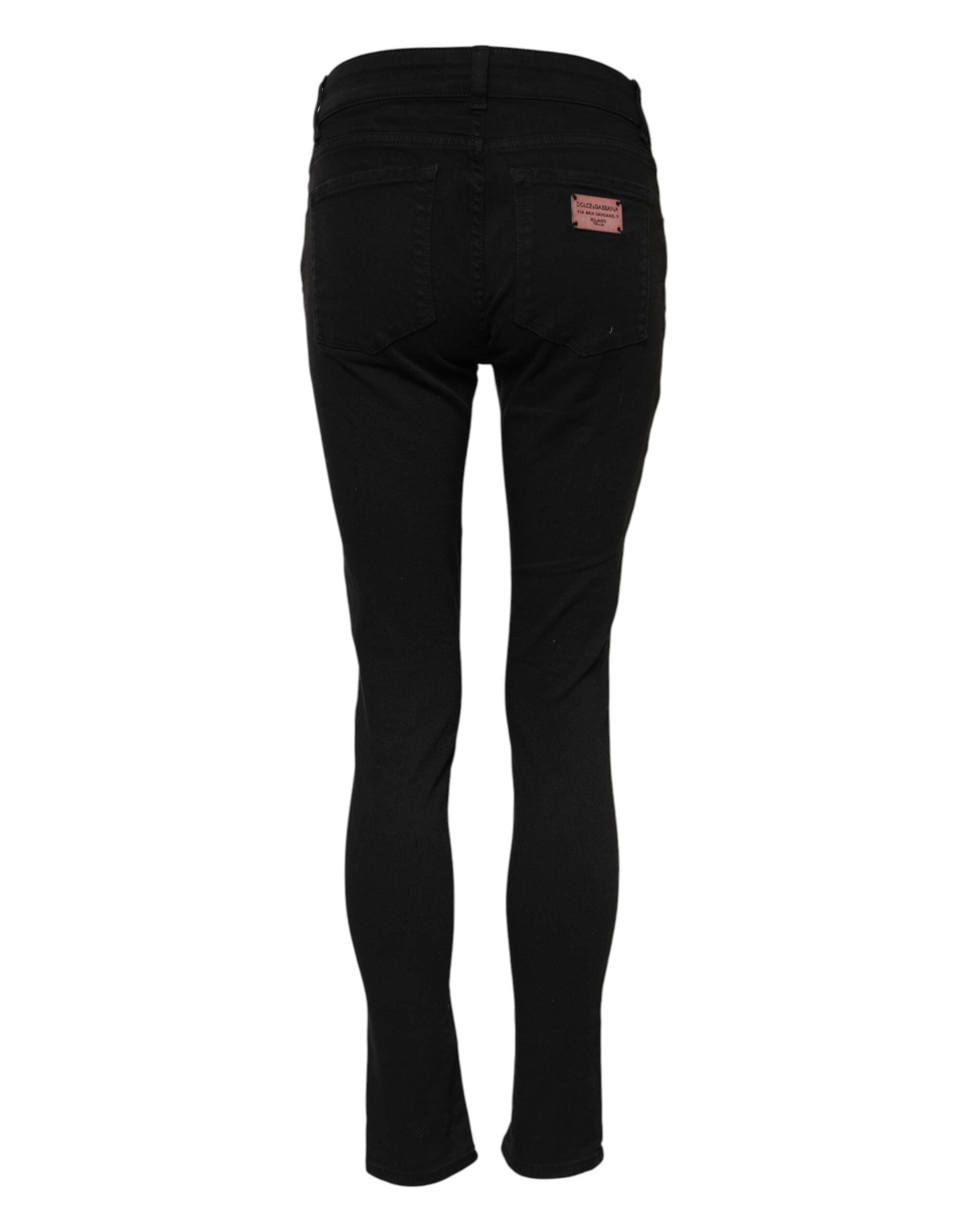 Elevate your wardrobe with Dolce & Gabbana's Black Cotton Skinny Mid Waisted Denim Jeans, crafted in Italy for a luxurious fit that embodies timeless sophistication.