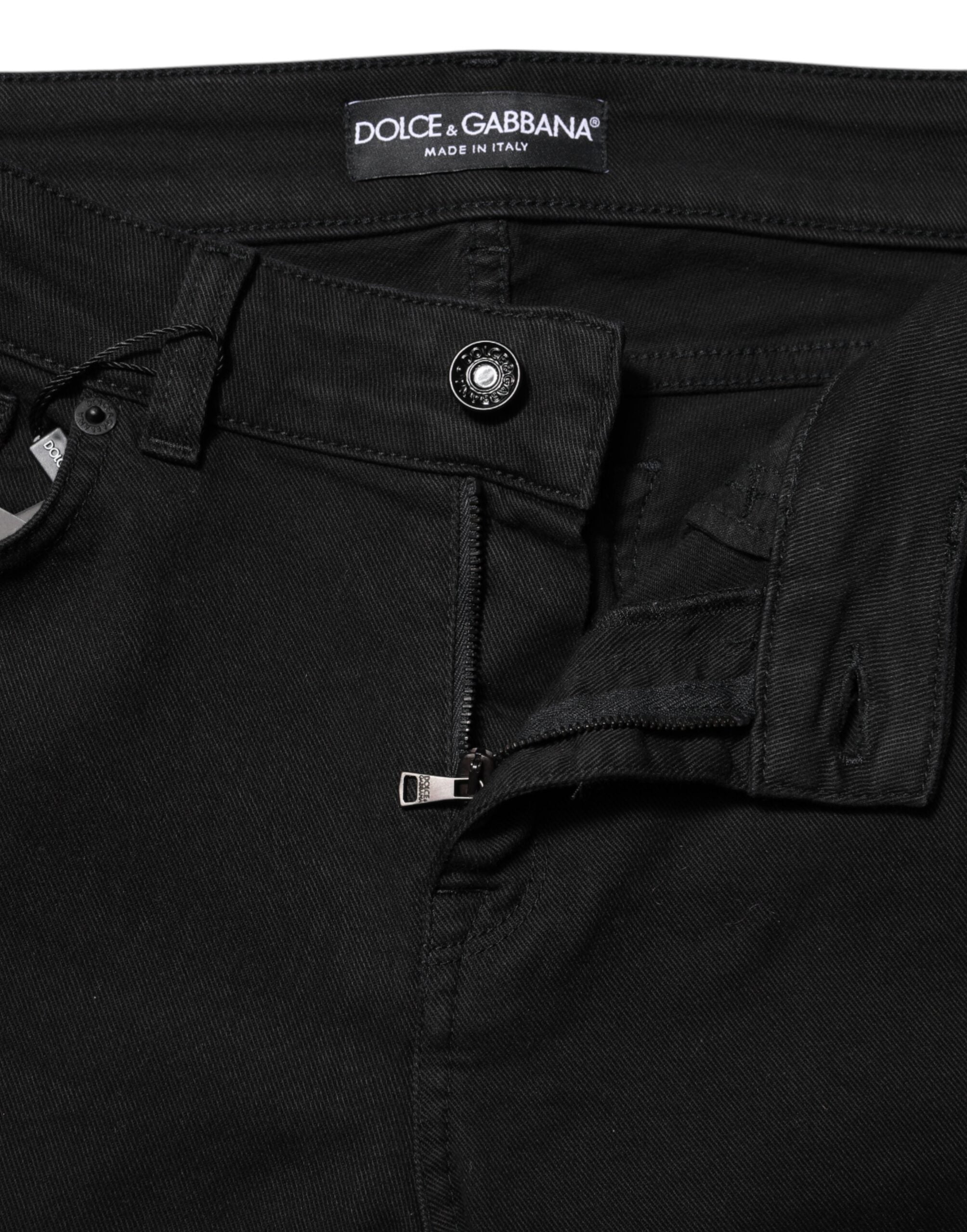 Experience the exquisite allure of Dolce & Gabbana's Black Cotton Skinny Mid Waisted Denim Jeans, crafted in Italy for a luxurious fit that enhances your silhouette with timeless sophistication.