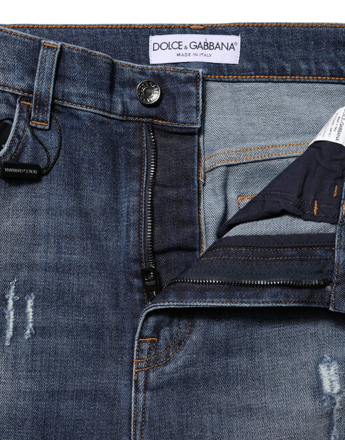 Indulge in the exquisite Dolce & Gabbana Blue Washed Cotton High Waisted Denim Jeans, where luxurious craftsmanship meets timeless elegance for the discerning individual.