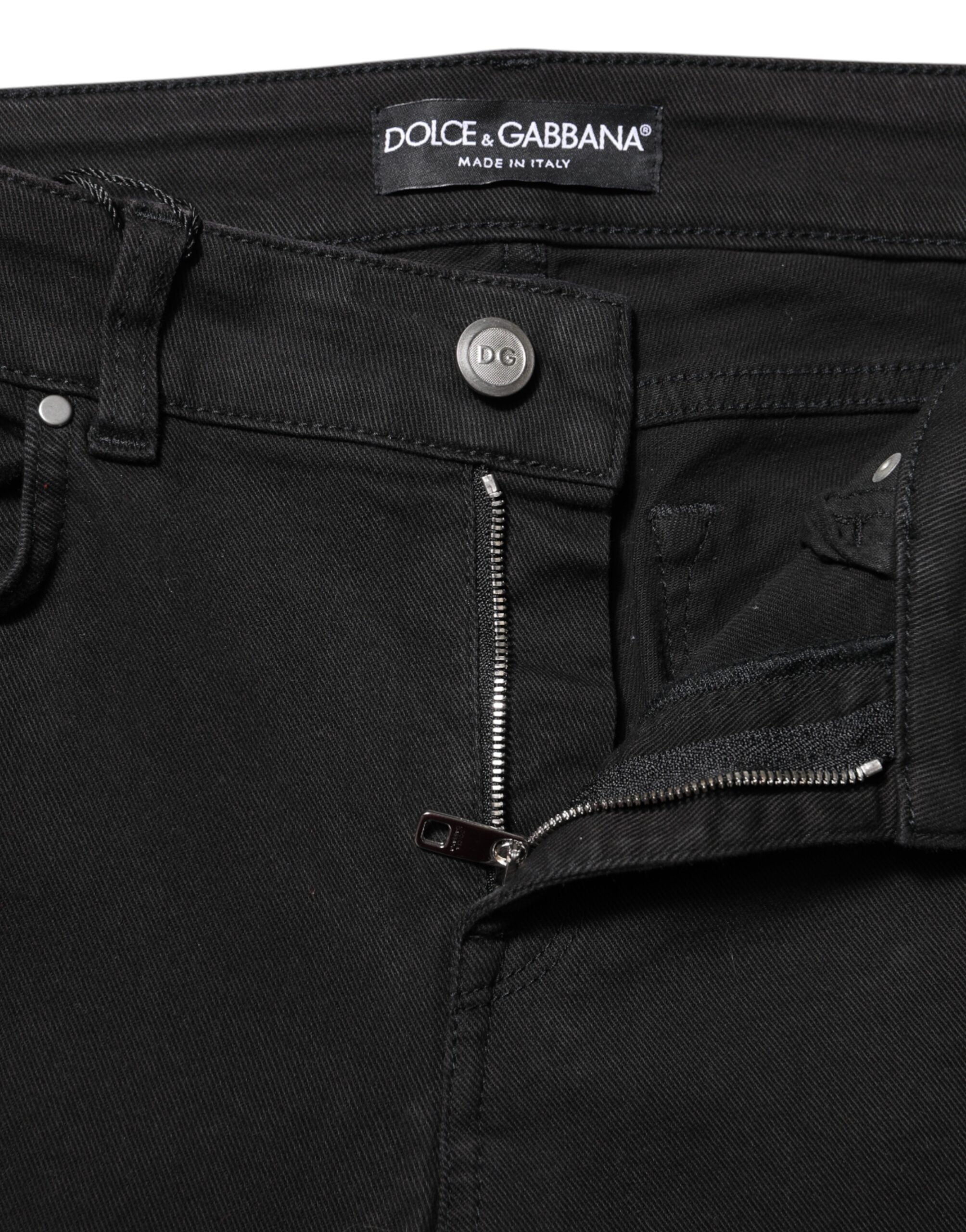 Indulge in the sophistication of Dolce & Gabbana's Black Cotton Skinny Mid Waisted Denim Jeans, crafted in Italy for a flawless fit that embodies timeless luxury and elegance.
