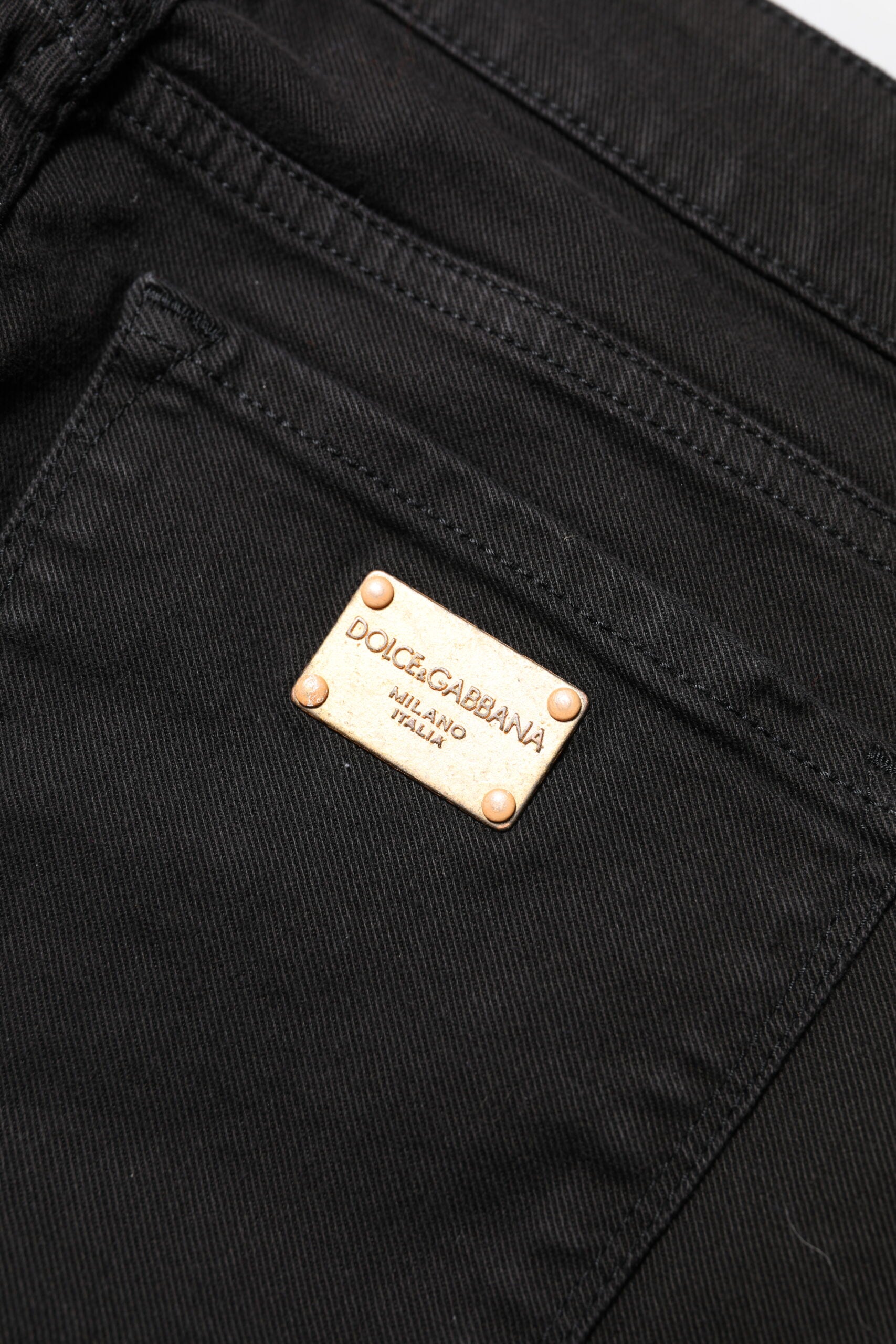 Indulge in the exquisite allure of Dolce & Gabbana's Black Cotton Skinny Mid Waisted Denim Jeans, crafted in Italy for a timeless, luxurious fit that elevates your style.