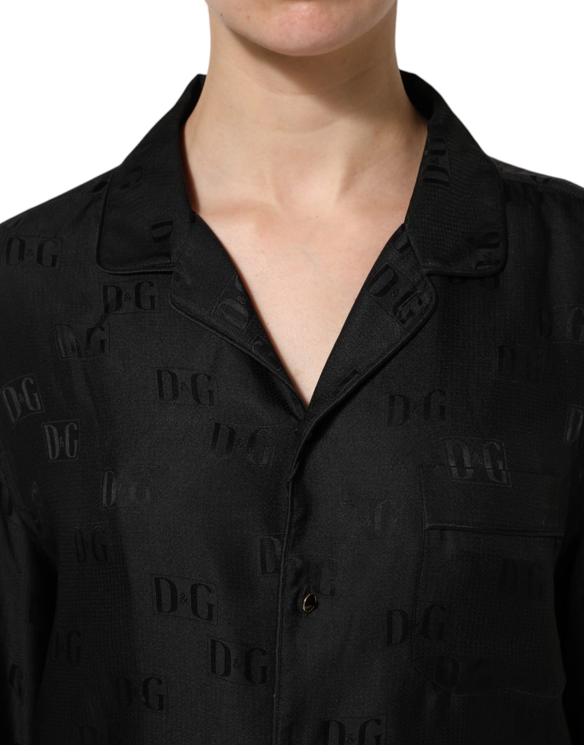 Elevate your wardrobe with the Dolce & Gabbana Black Silk DG Embroidery Long Sleeves Top, a masterpiece of Italian craftsmanship that embodies timeless elegance and sophistication.