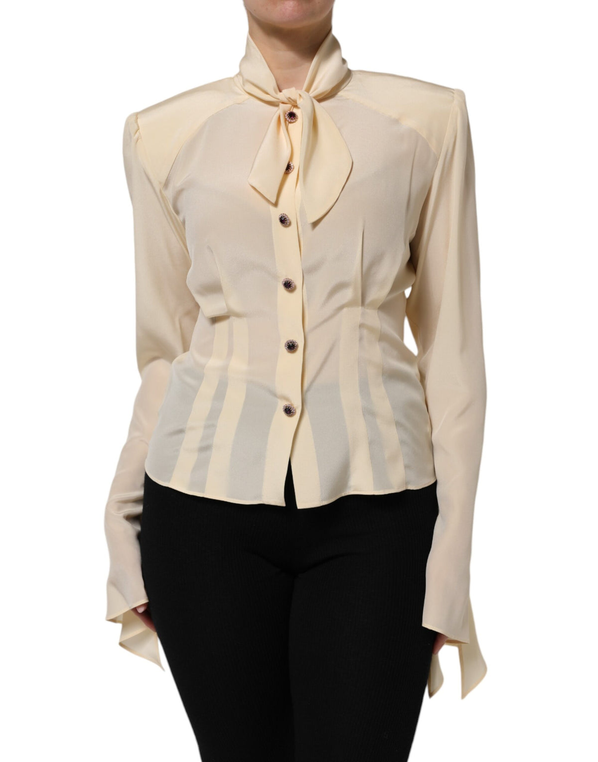 Indulge in the exquisite allure of Dolce & Gabbana's Light Yellow Silk Ascot Collared Blouse, a limited edition masterpiece that embodies timeless elegance and Italian craftsmanship.