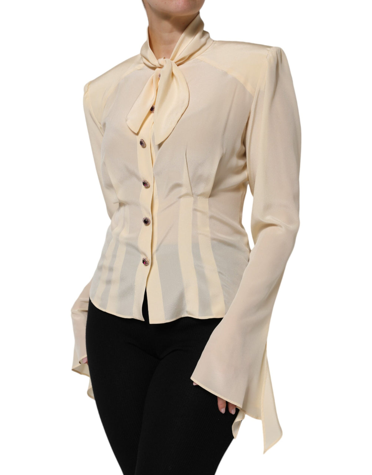 Experience the allure of Dolce & Gabbana's Light Yellow Silk Ascot Collared Blouse, a limited edition masterpiece that embodies exquisite Italian craftsmanship and timeless elegance.