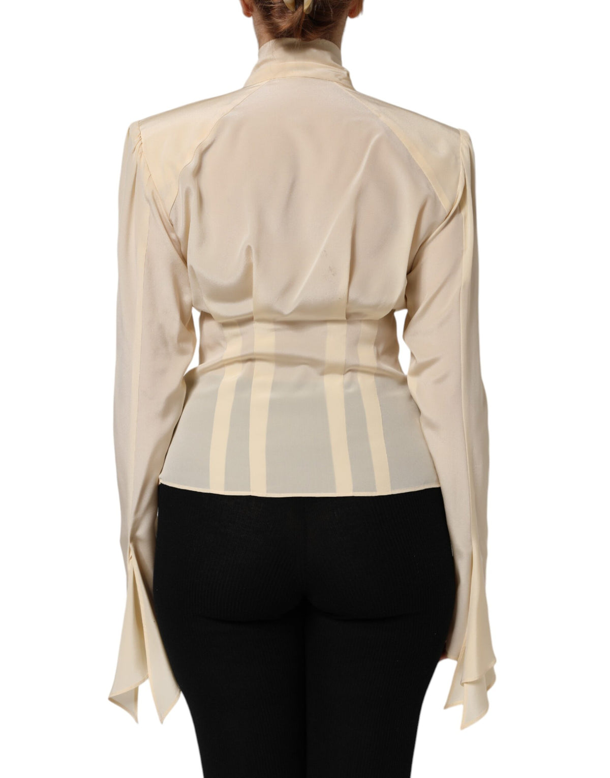 Indulge in the exquisite allure of the Dolce & Gabbana Light Yellow Silk Ascot Collared Blouse, a limited edition masterpiece that embodies timeless elegance and refined Italian craftsmanship.