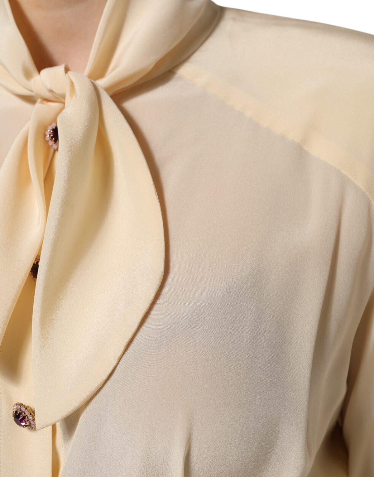 Experience the allure of Dolce & Gabbana's Light Yellow Ascot Collar Blouse, a silk masterpiece that embodies Italian elegance and timeless sophistication.