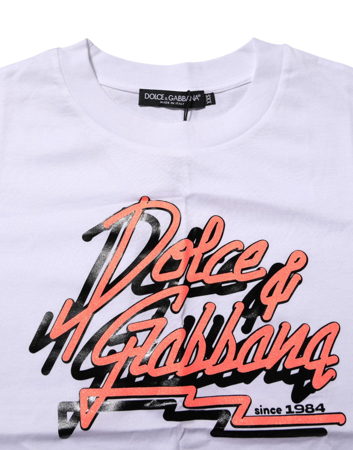 Indulge in the exquisite Dolce & Gabbana White Cotton Graphic Print Crew Neck T-shirt, a luxurious staple that embodies Italian artistry and timeless elegance.
