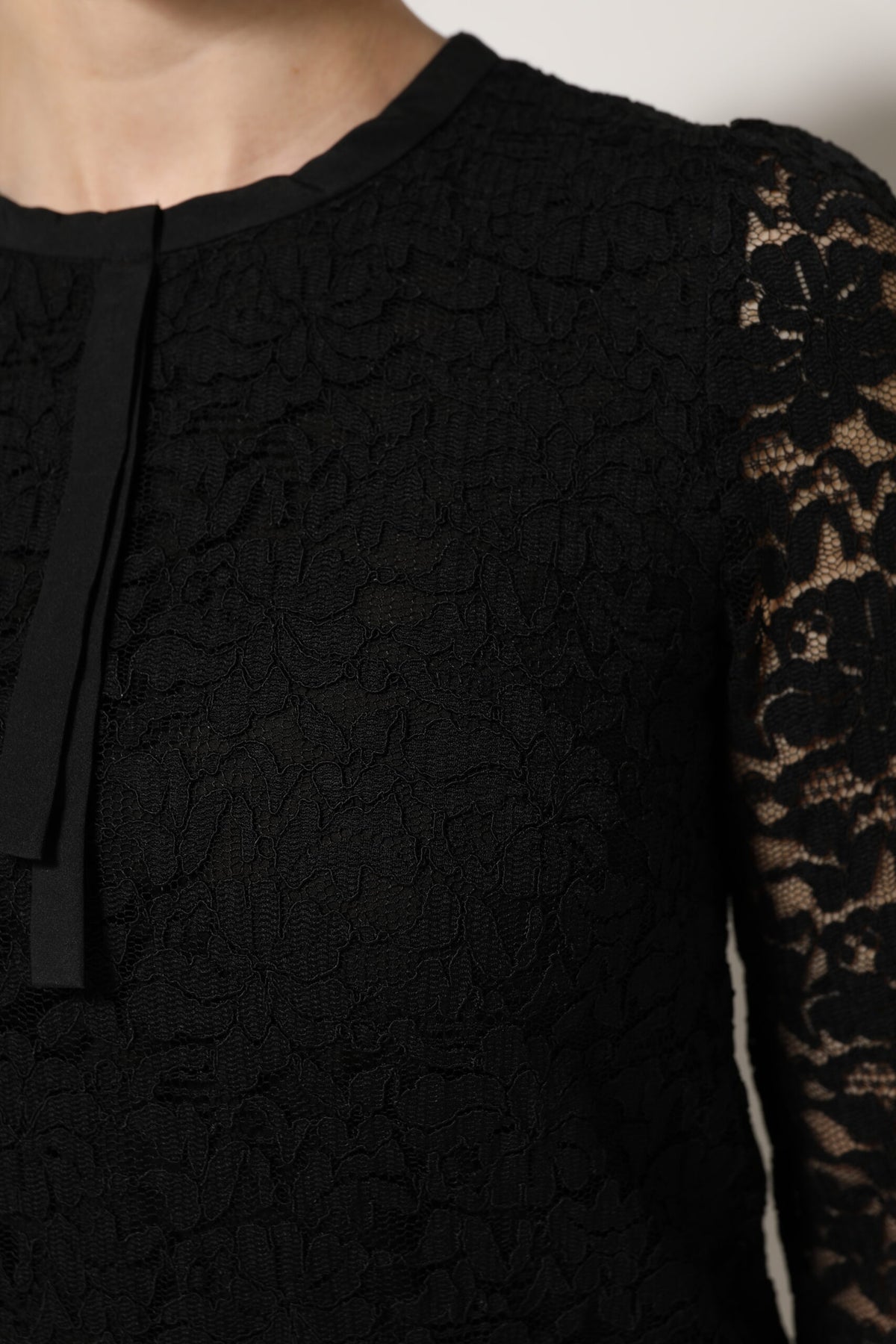Elevate your wardrobe with the Dolce & Gabbana Black Nylon Lace Long Sleeve Blouse, a testament to Italian craftsmanship and timeless elegance, perfect for any occasion.