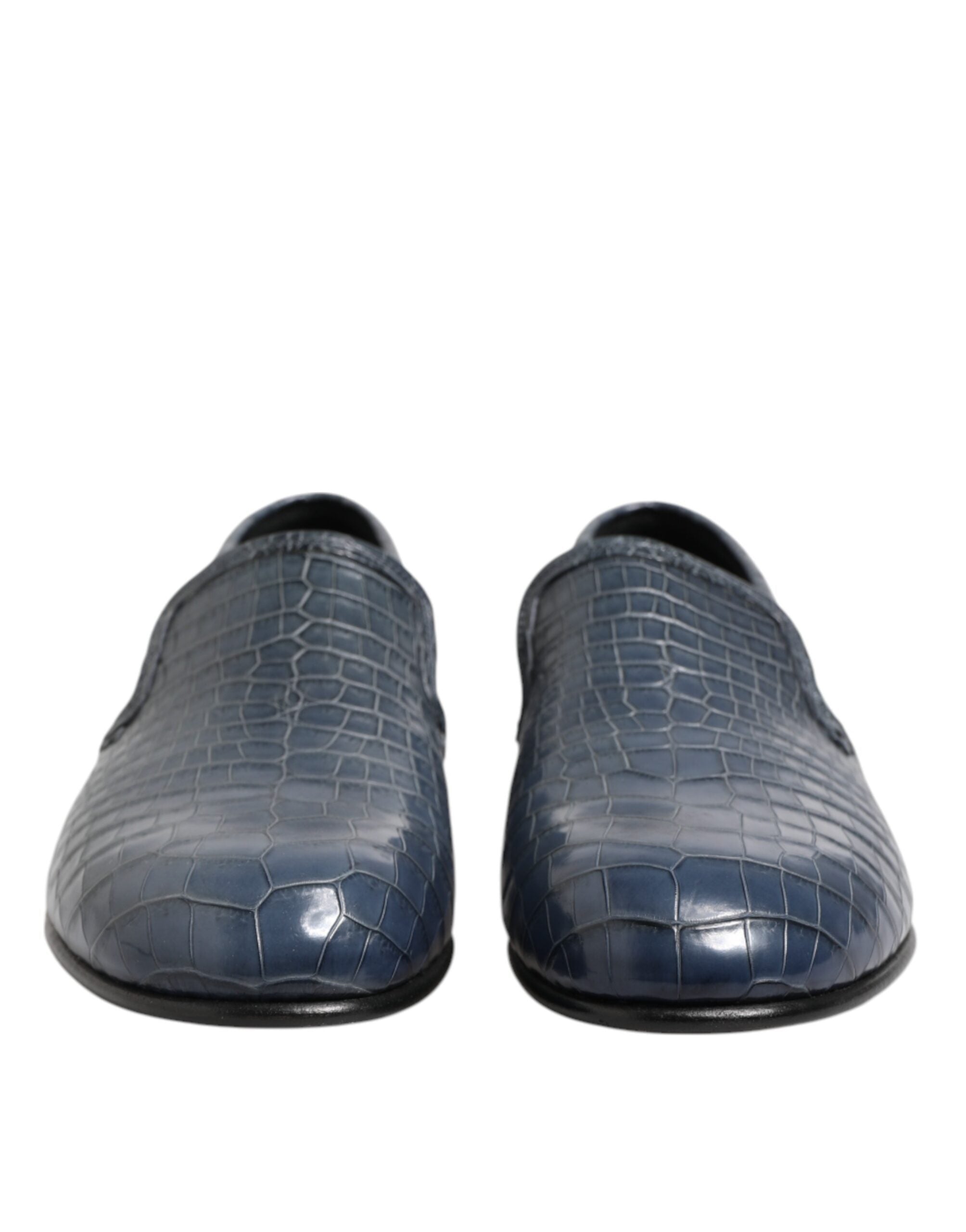 Experience the allure of Dolce & Gabbana's Blue Exotic Leather Slip On Loafers, where sumptuous crocodile leather meets Italian craftsmanship for the discerning connoisseur.