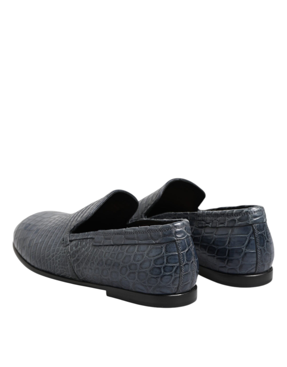 Indulge in the exquisite craftsmanship of Dolce & Gabbana's Blue Exotic Leather Slip On Loafers, a symbol of luxury and refined elegance for the discerning individual.