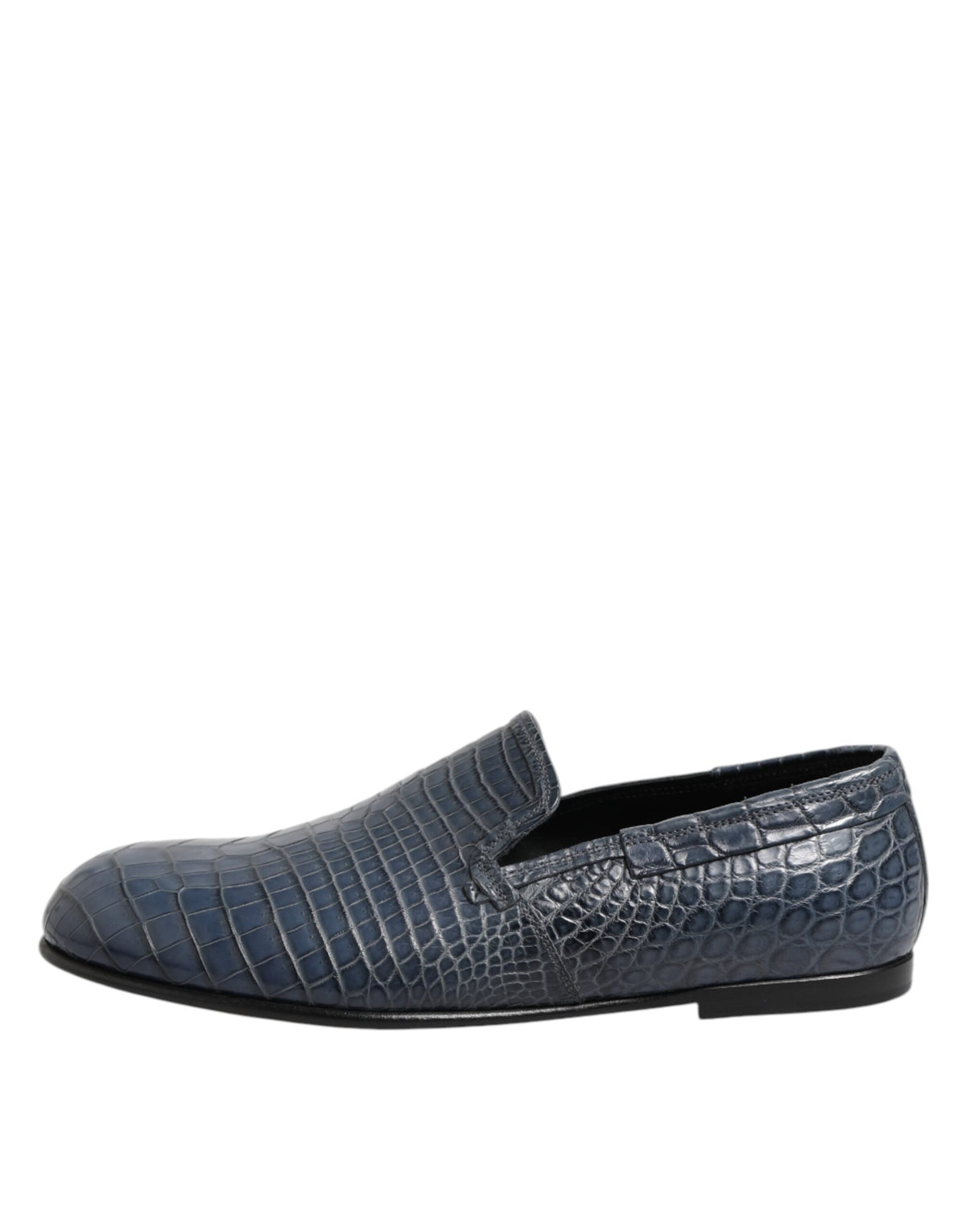 Experience the allure of Dolce & Gabbana's Blue Exotic Leather Slip On Loafers, crafted from luxurious crocodile leather, embodying timeless elegance and sophistication.