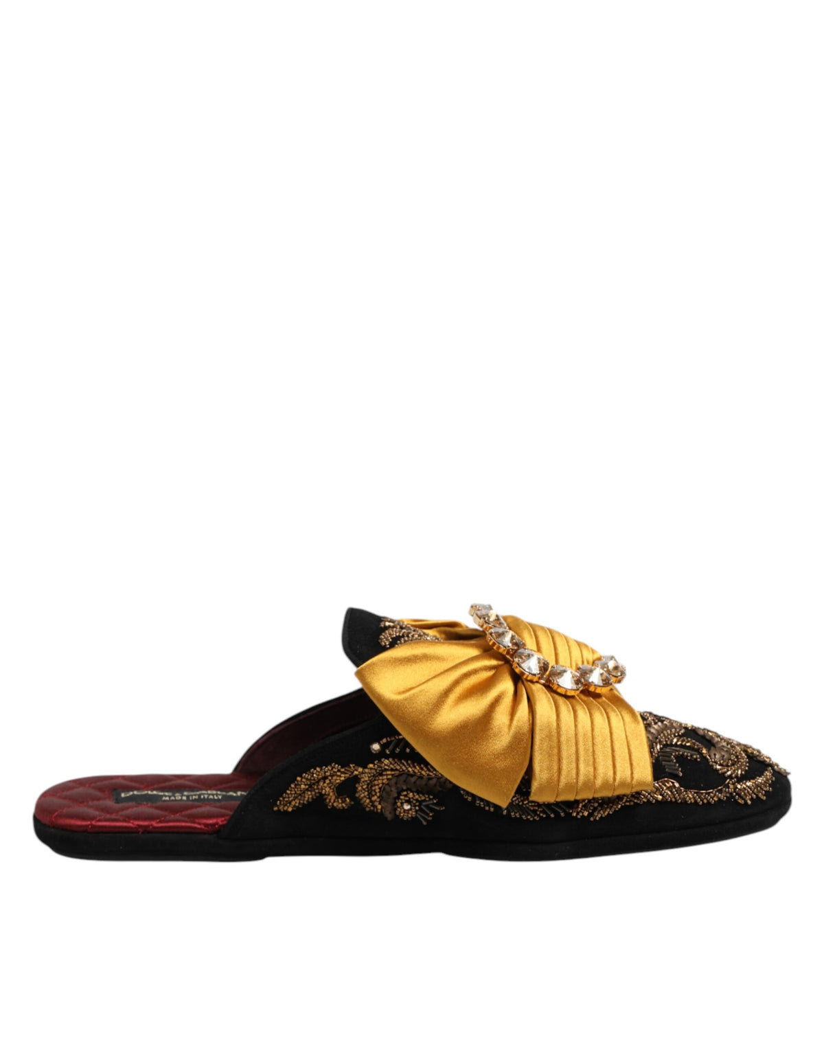 Indulge in the exquisite craftsmanship of Dolce & Gabbana's multicolor embellished flat sandals, a luxurious statement of elegance and style, perfect for the discerning individual.
