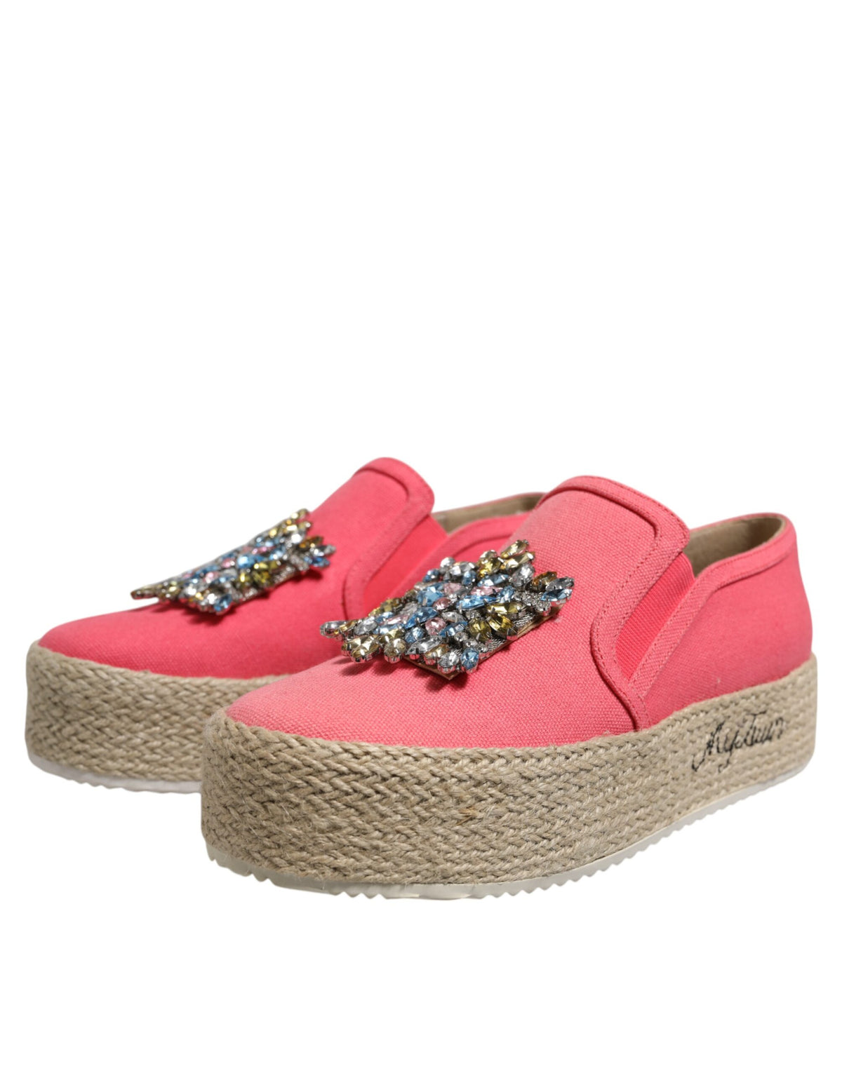 Experience the allure of Twinset's Pink Canvas Crystal Embellished Slip On Shoes, where exquisite craftsmanship meets timeless elegance, perfect for the discerning individual.