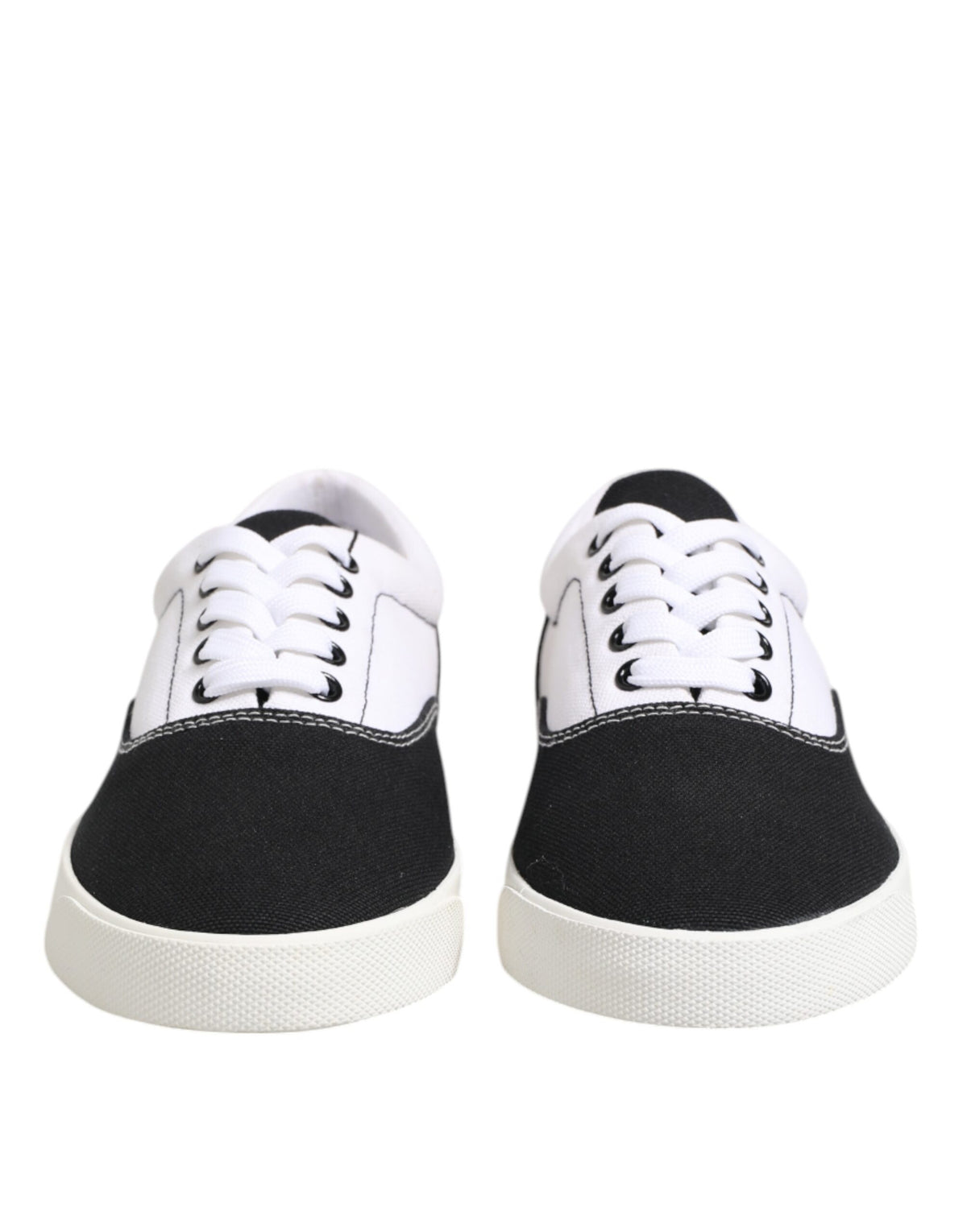 Elevate your style with Dolce & Gabbana's Black Cotton Canvas Lace Up Sneakers, where exquisite craftsmanship meets luxurious comfort for the discerning individual.