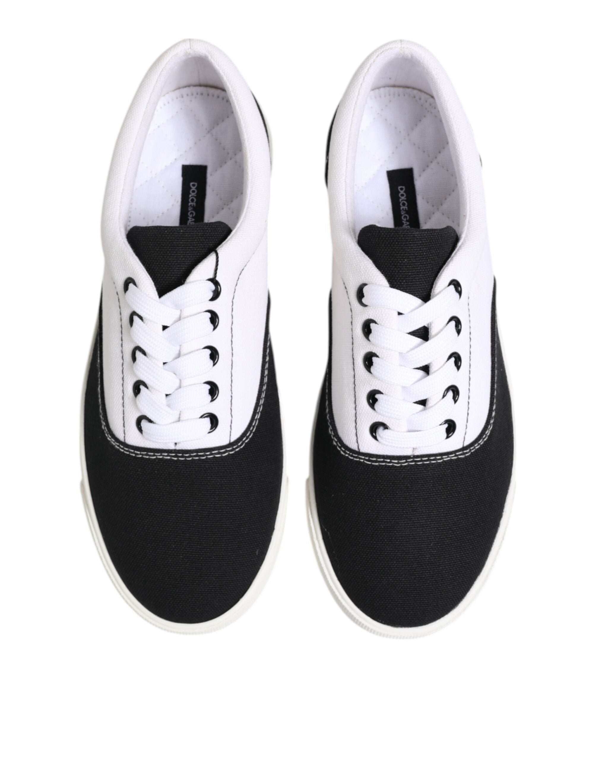 Experience the allure of Dolce & Gabbana's Black Cotton Canvas Lace Up Sneakers, where exquisite craftsmanship meets modern elegance, perfect for the discerning individual.