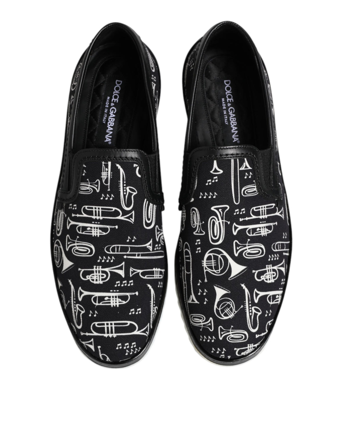 Step into elegance with Dolce & Gabbana's Black Slip On Printed Loafers, where luxurious craftsmanship meets contemporary style, perfect for the discerning connoisseur.