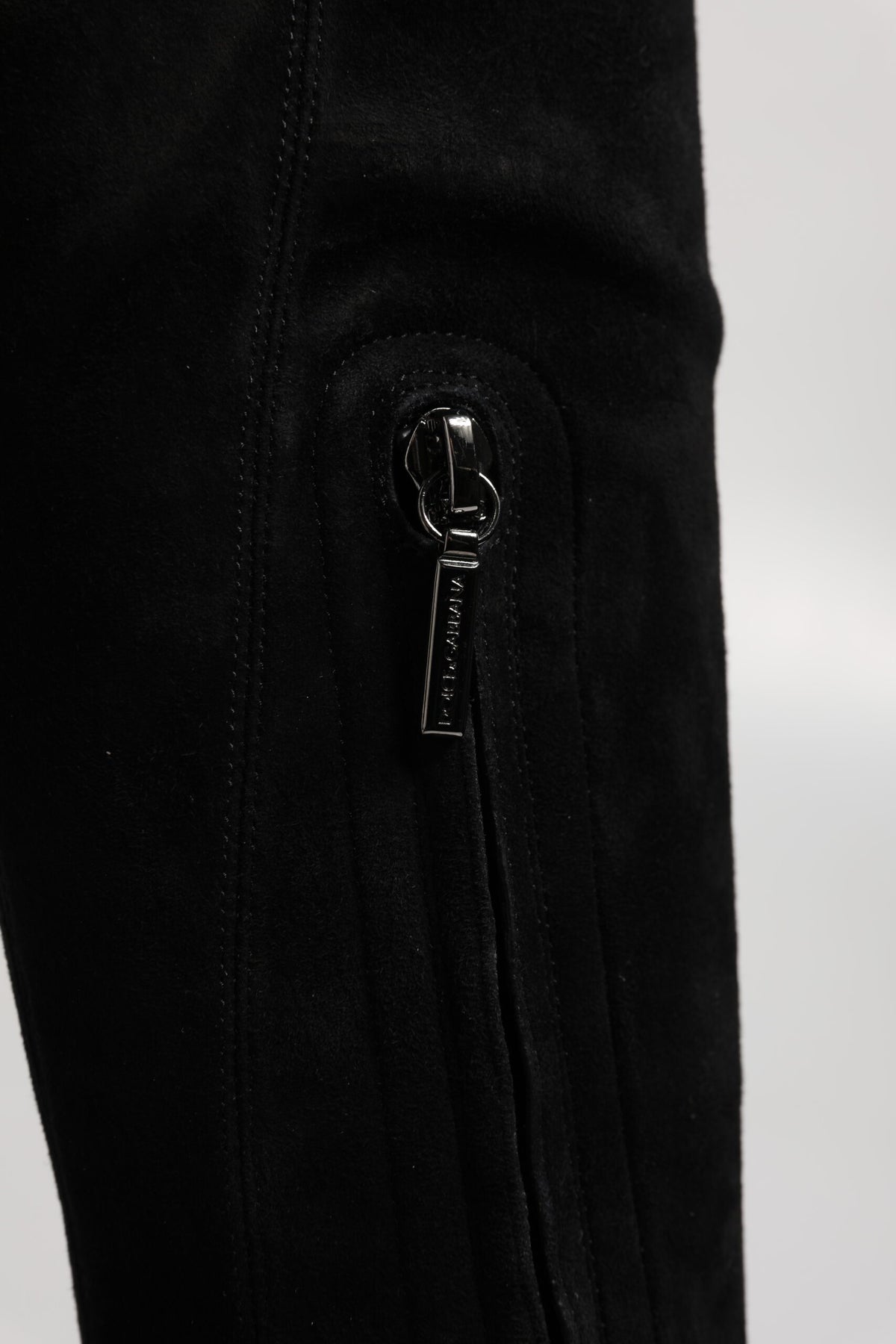 Indulge in the exquisite allure of Dolce & Gabbana's Black Suede Leather Knee High Boots, crafted from luxurious lamb leather for a statement of timeless elegance and sophistication.