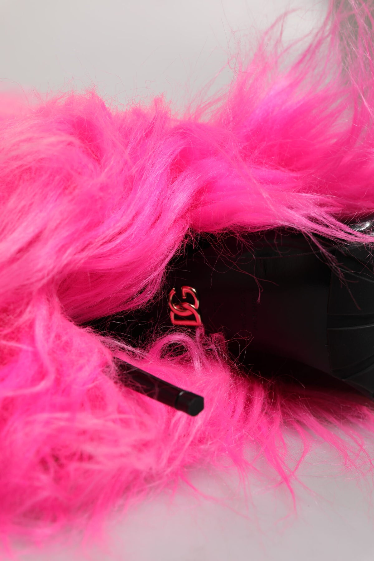 Step into opulence with Dolce & Gabbana's Pink Faux Fur Leather High Heels Boots, where exquisite craftsmanship meets timeless allure, perfect for any sophisticated occasion.