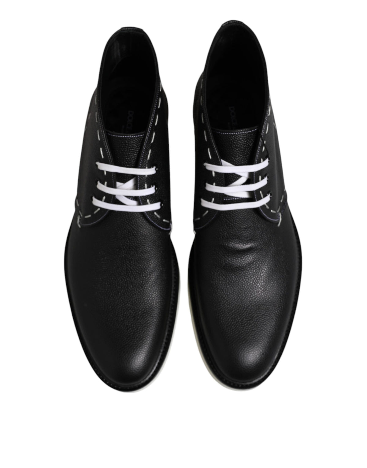 Indulge in the exquisite Dolce & Gabbana Black White Leather Ankle Boots, a masterpiece of Italian craftsmanship that elevates your style with unmatched elegance and allure.