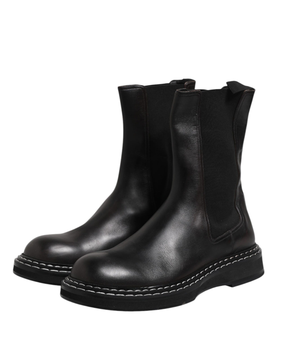 Step into the realm of Italian luxury with Dolce & Gabbana's Black Leather Mid Calf Boots, where exquisite craftsmanship meets timeless elegance for the discerning individual.