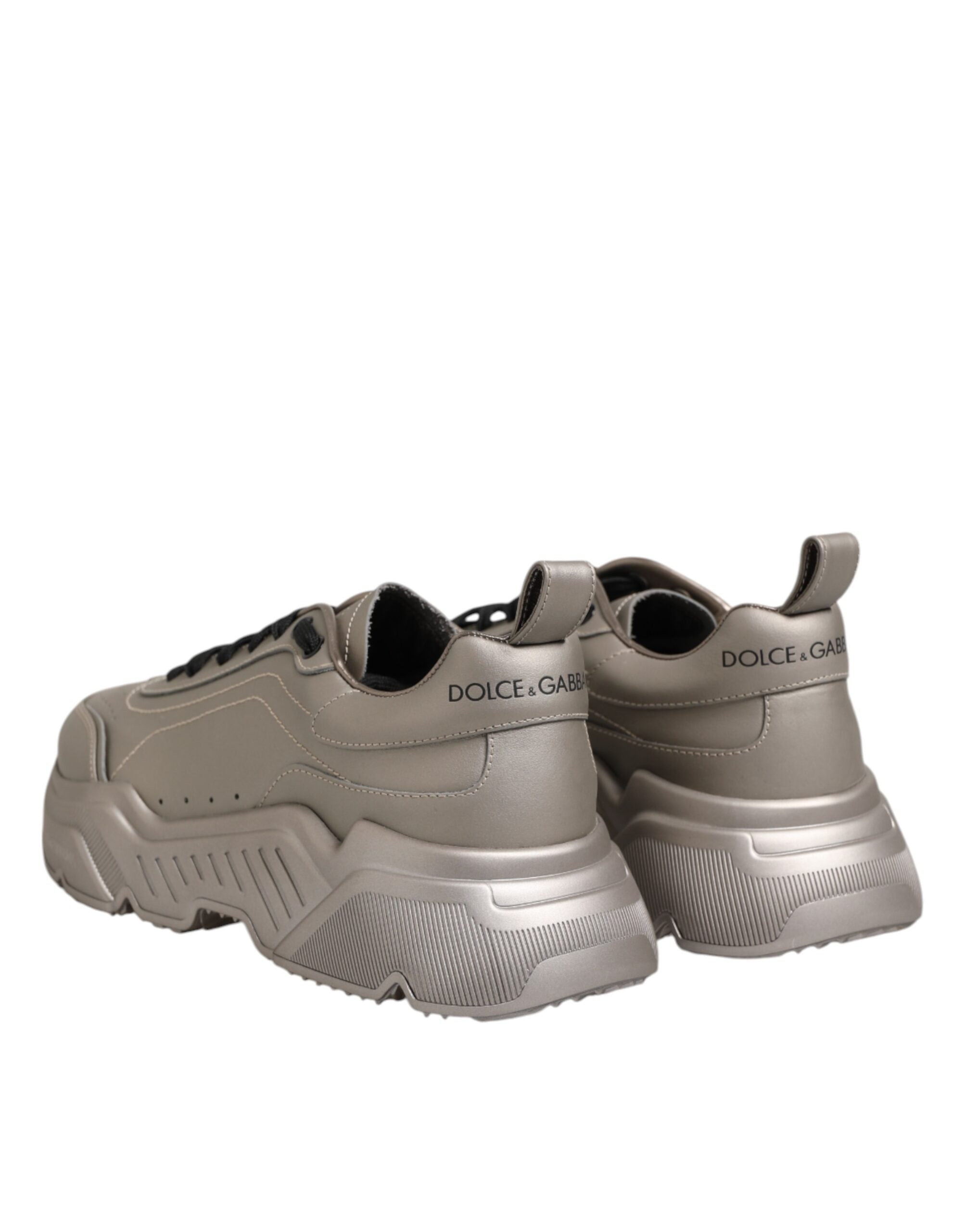 Experience the allure of Dolce & Gabbana Silver DAYMASTER sneakers, crafted from premium calf leather, where exquisite Italian craftsmanship meets timeless elegance for the discerning connoisseur.