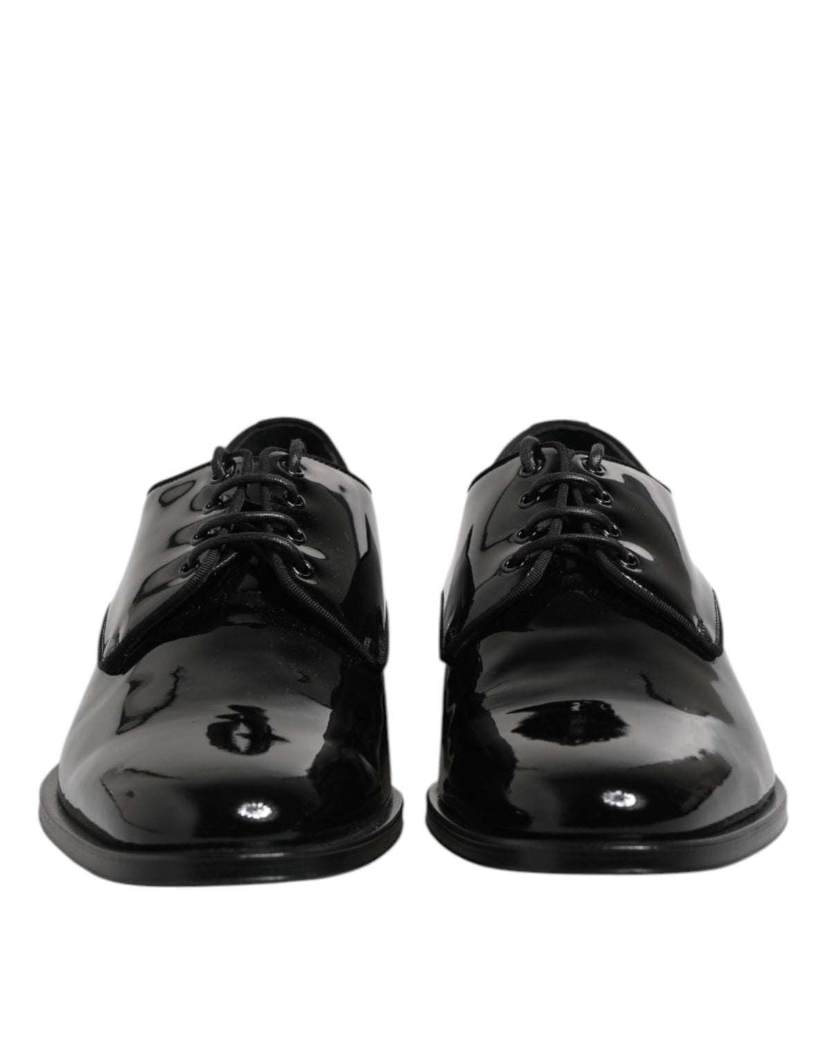 Indulge in the exquisite craftsmanship of Dolce & Gabbana Black Patent Leather Derby Formal Dress Shoes, where timeless elegance meets luxurious allure for the discerning individual.